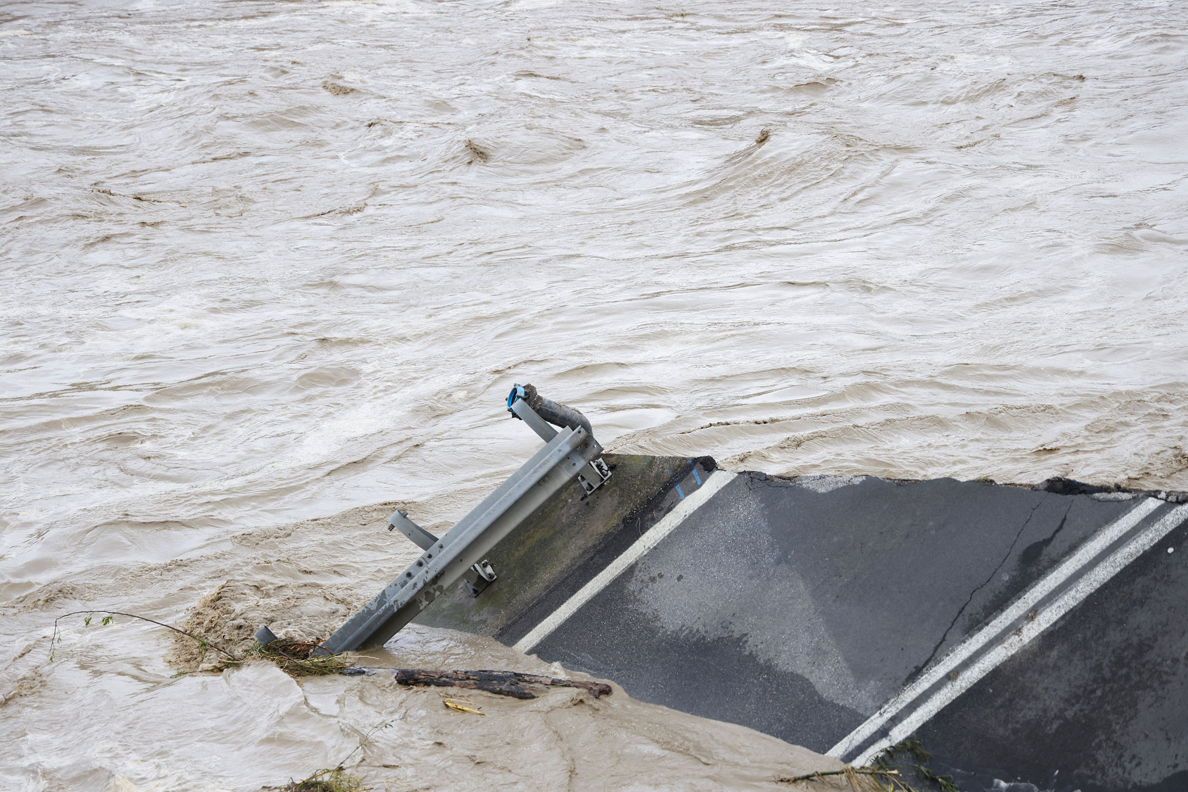 A collapsed bridge can be seen in the aftermath of a heavy rain that hit Italy's northern Emilia-Romagna region, in Budrio near Bologna, on May 17. (Claudia Greco—Reuters)