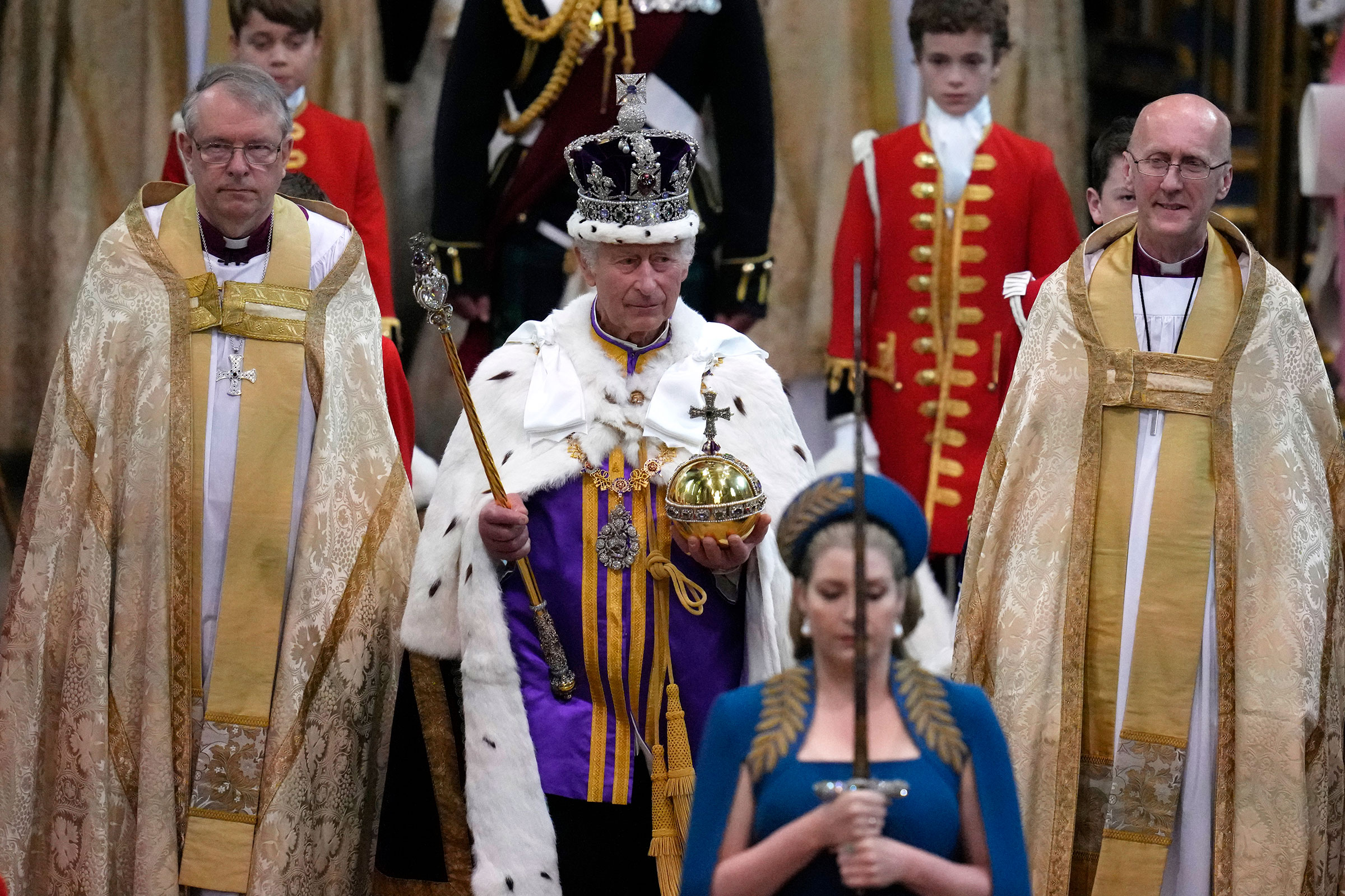 Britain's King Charles III walks in the Coronation Procession after his coronation ceremony. (Kirsty Wigglesworth—Pool/AP)