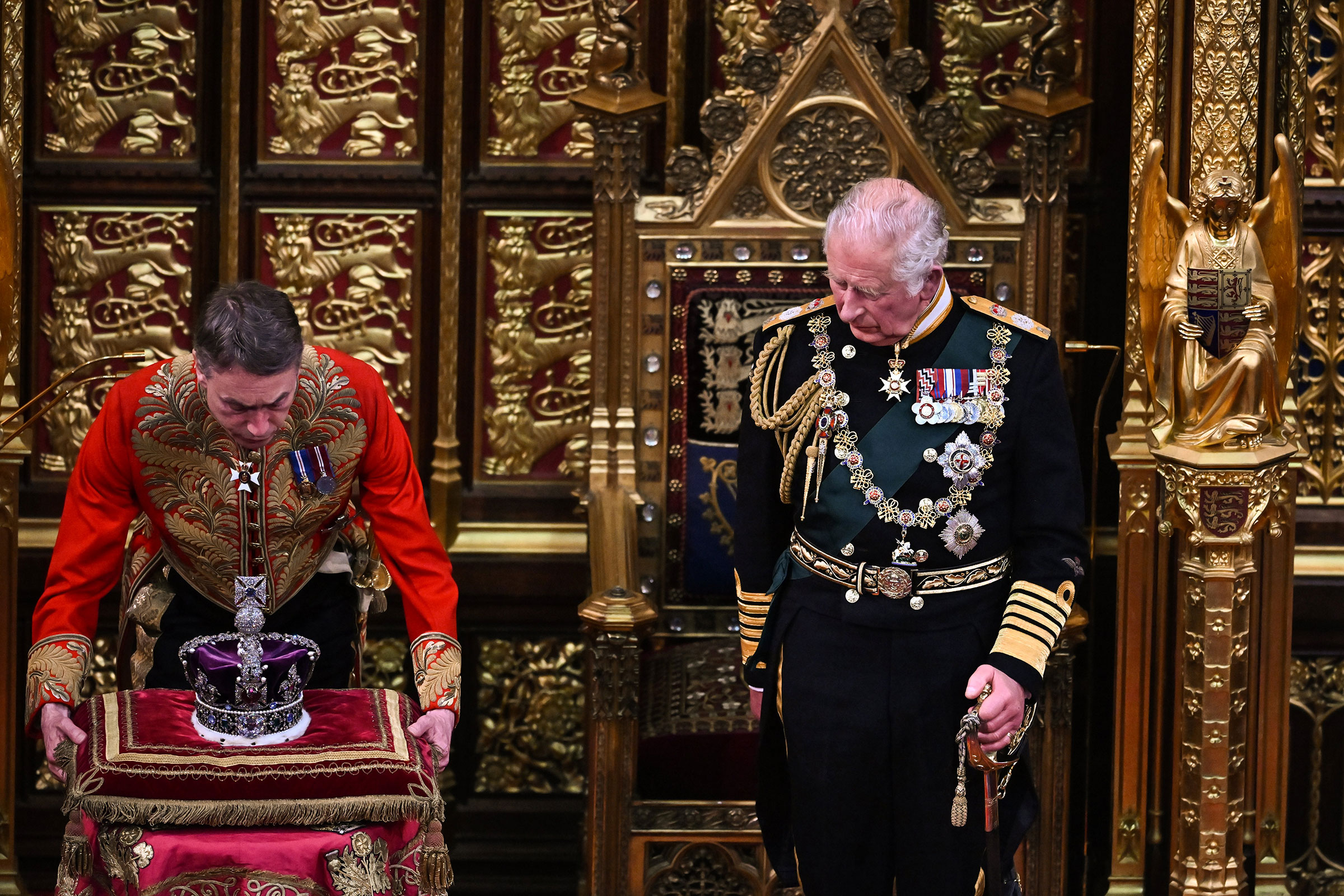 Prince Charles looks at The Imperial State Crown after delivering a speech during the State Opening of Parliament in the House of Lords at the Palace of Westminster on May 10, 2022 in London. (Ben Stansall—WPA Pool—Getty Images)
