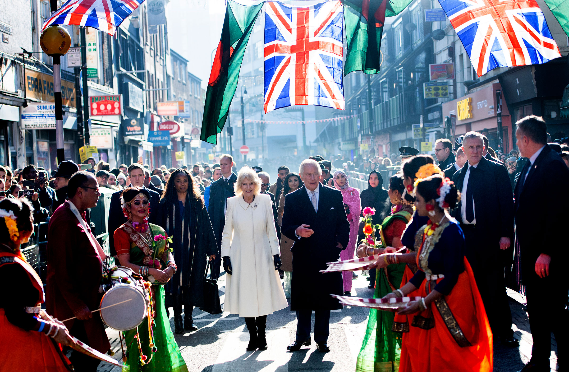 King Charles III and Camilla, Queen Consort meet members of the public during a visit to the Bangladeshi community of Brick Lane on February 8, 2023 in London, England. (Eddie Mulholland—WPA Pool/Getty Images)