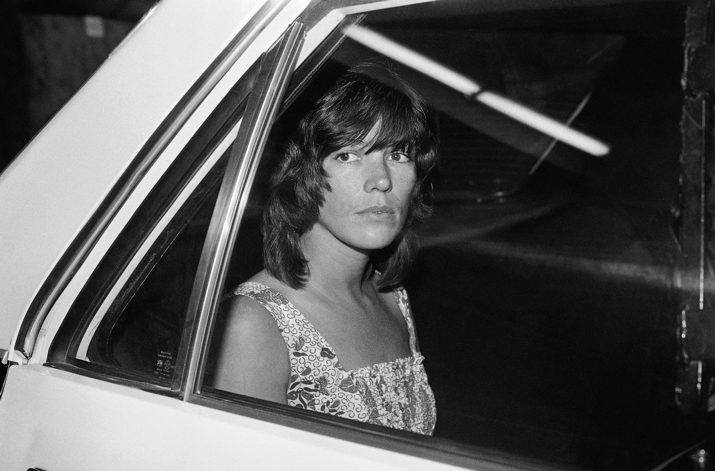Leslie Van Houten, a former Charles Manson follower, looks from the window of a sheriff’s van as she left the county court house following her court appearance for sentencing in 1978