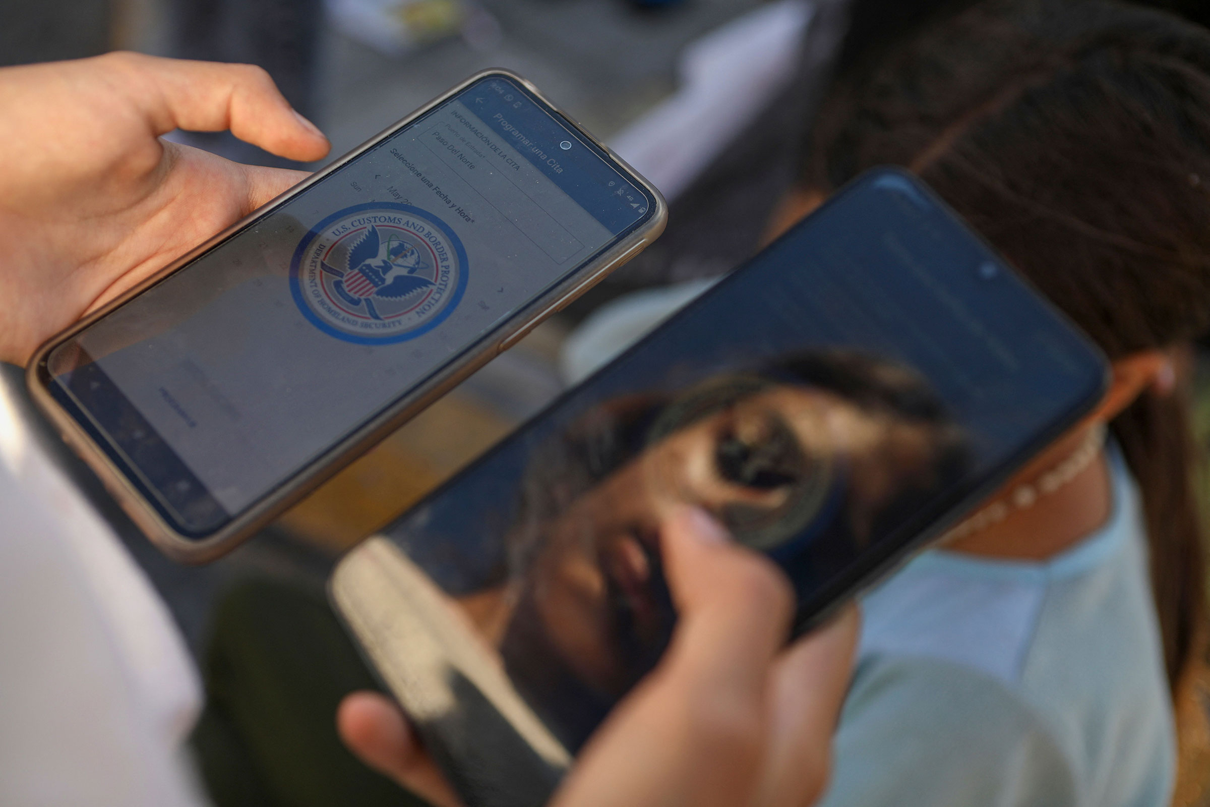 A Venezuelan migrant browses the CBP One mobile app searching for an appointment to enter the United States outside the temporary stay of the National Migration Institute (INM) in Ciudad Juarez, Chihuahua state, Mexico, on May 5, 2023. (Herika Martinez—AFP/Getty Images)