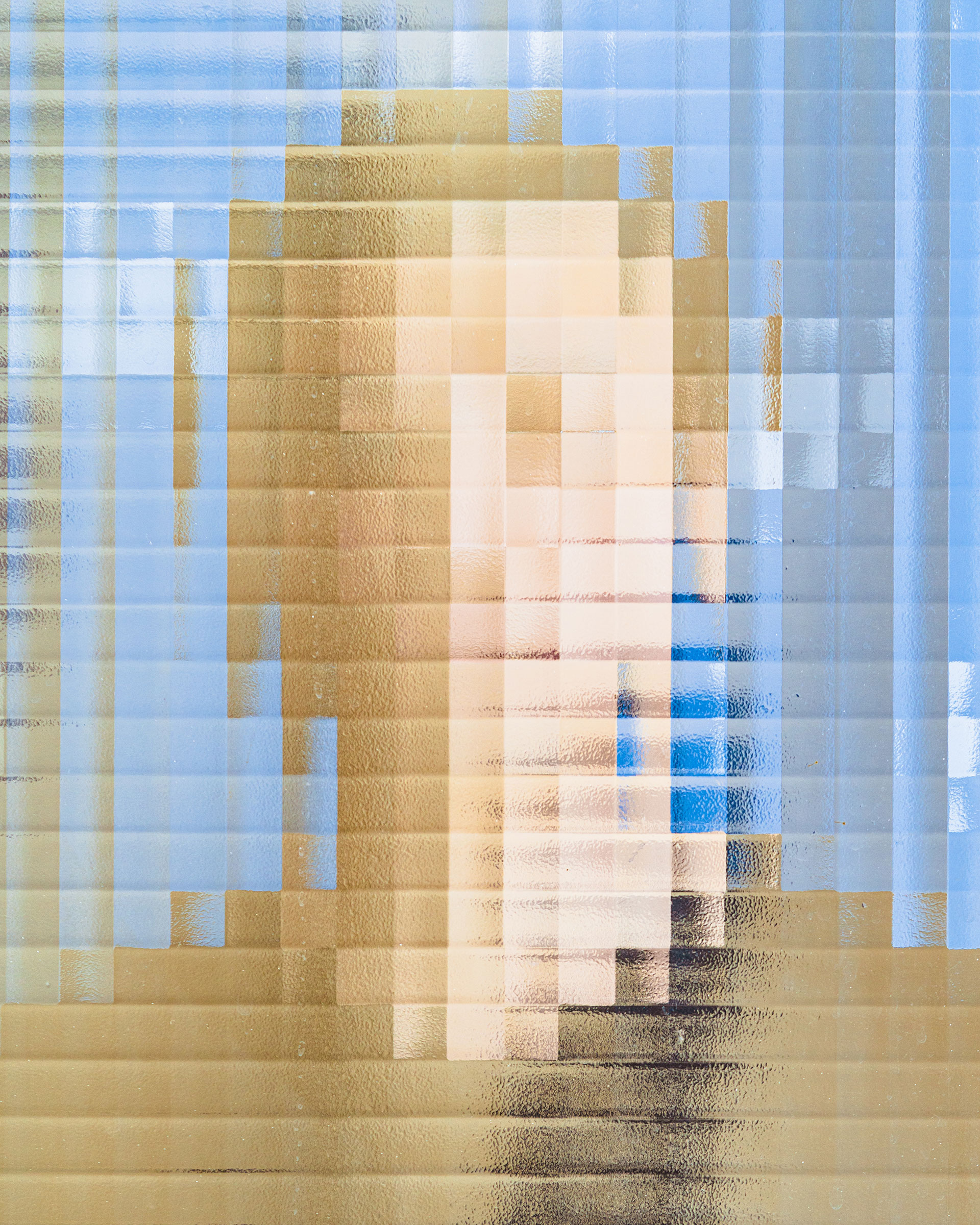 face behind pixelated glass