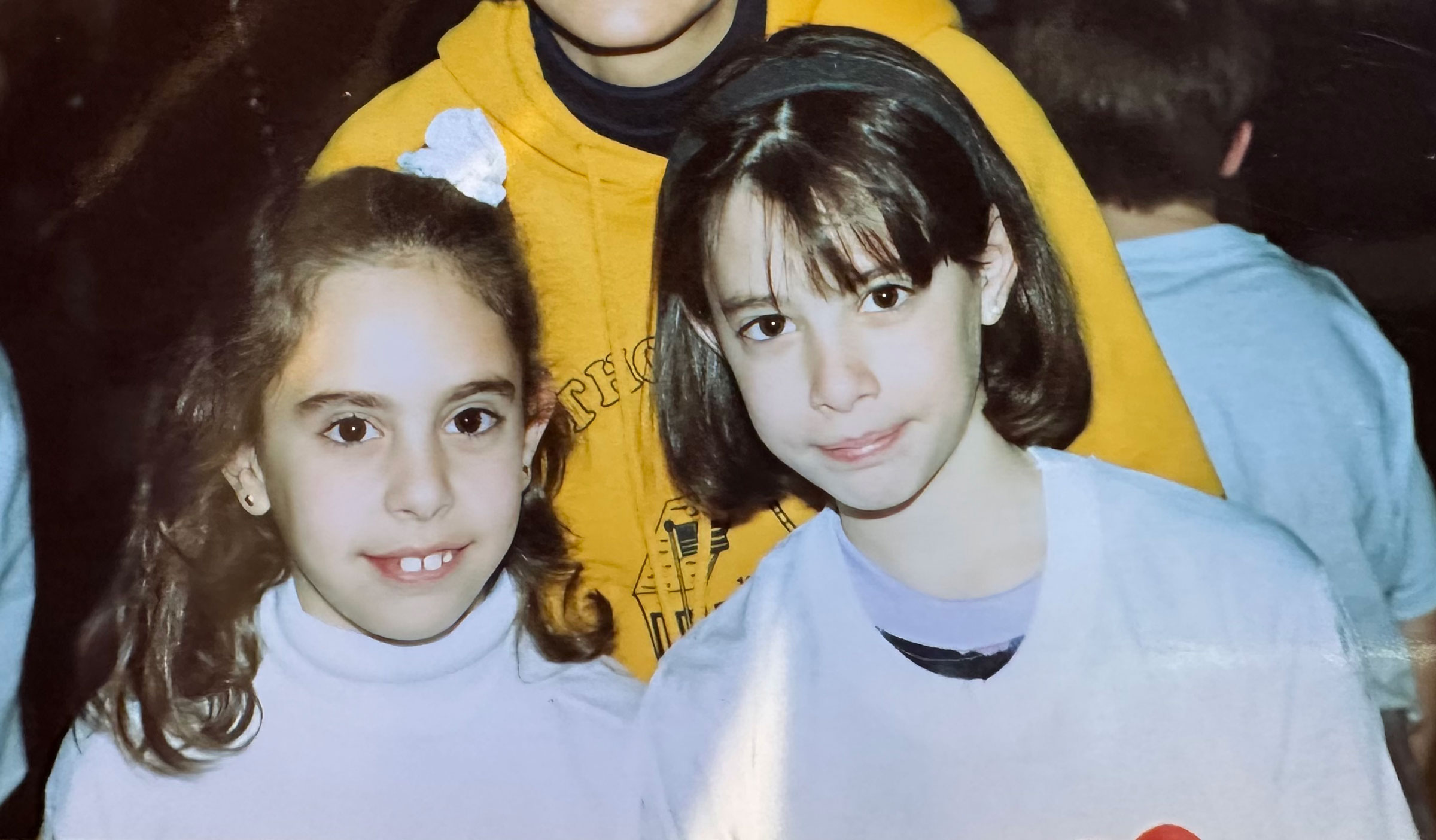 The author and her friend in a childhood photo.