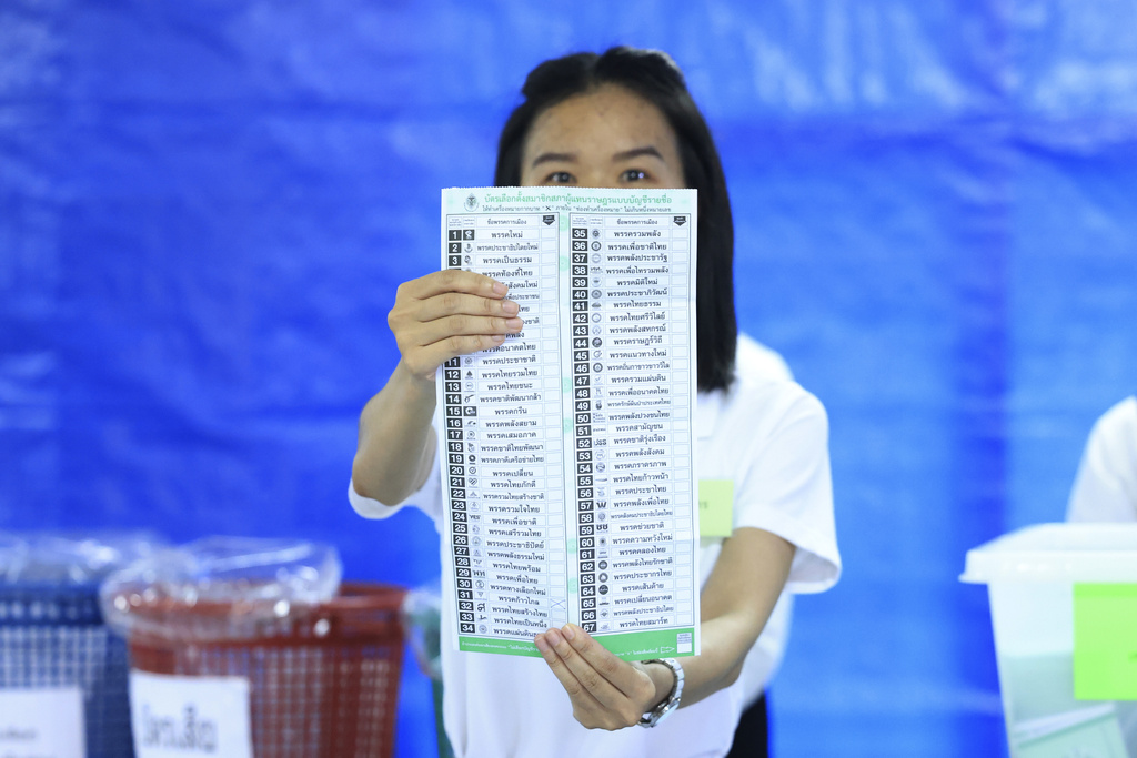 A Thai officer shows a ballot during vote counting at polling station in Bangkok, Sunday, May 14, 2023. (Rapeephat Sitichailapa—AP)