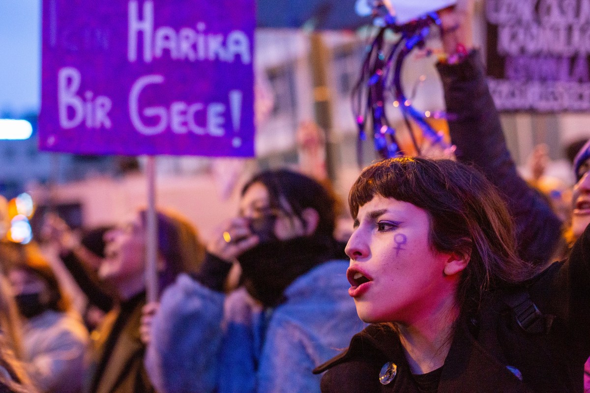 A protester shouts at the feminist night march on March 8, 2022.