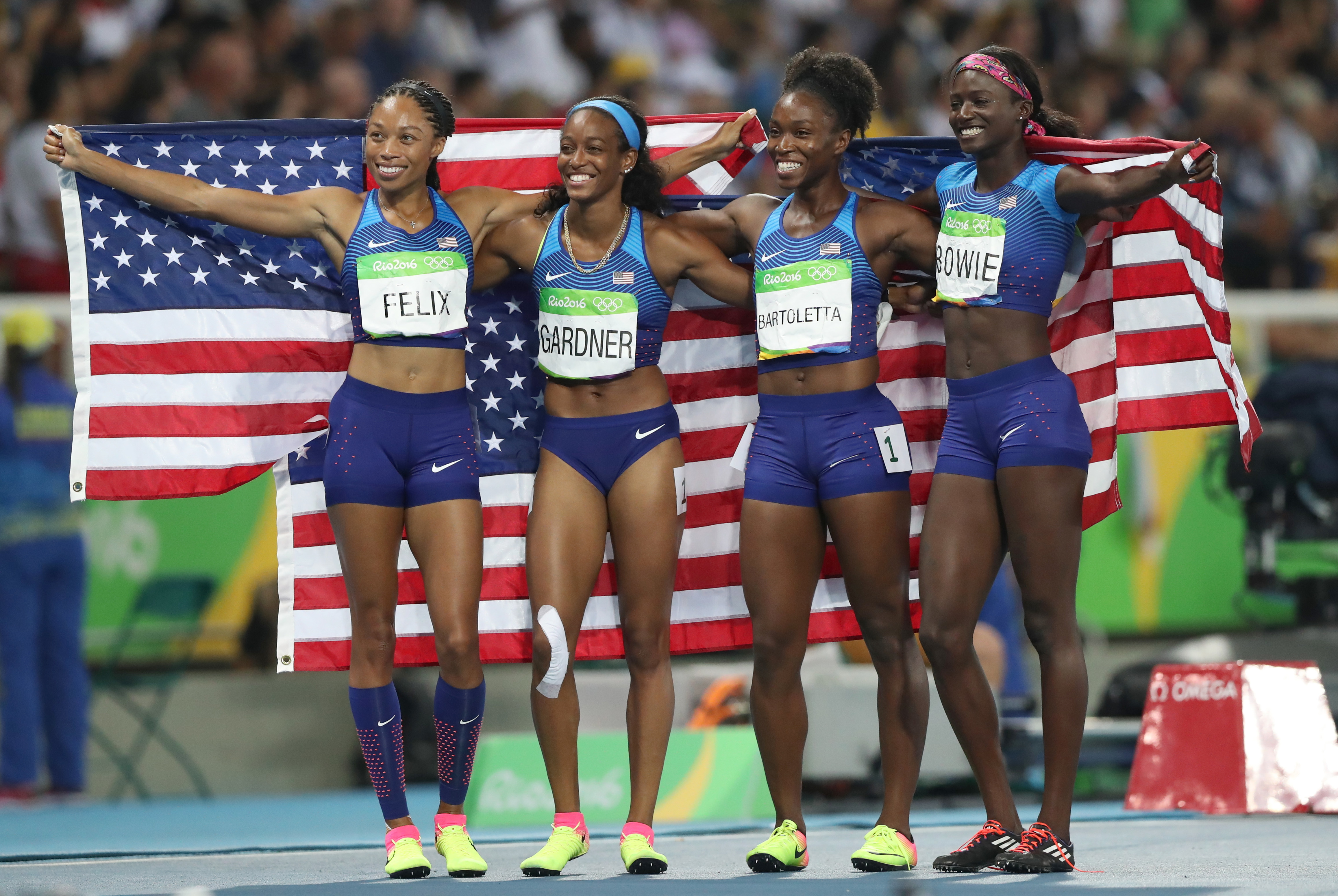The United States team from left, Allyson Felix, English Gardner, Tianna Bartoletta and Tori Bowie celebrate winning the gold medal in the women's 4x100-meter relay final during the athletics competitions of the 2016 Summer Olympics at the Olympic stadium in Rio de Janeiro, Brazil, Friday, Aug. 19, 2016. (AP Photo/Lee Jin-man)