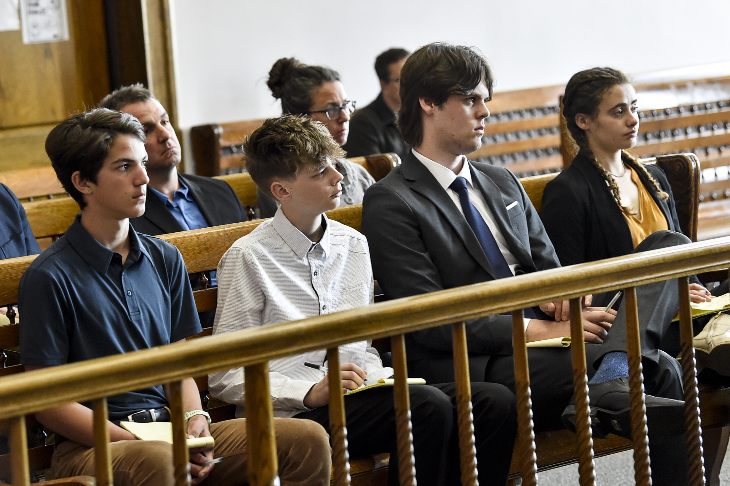 Plaintiffs Mica, 14; Badge 15, Lander 18, and Taleah, 19, listen to arguments during a status hearing on May 12, 2023, in Helena, Mont., for a case that they and other Montana youth filed against the state arguing Montana officials are not meeting their constitutional obligations to protect residents from climate change. The first-of-its-kind trial begins Monday, June 12, 2023, before District Court Judge Kathy Seeley in Helena. It is scheduled to last for two weeks. (Thom Bridge/Independent Record via AP)