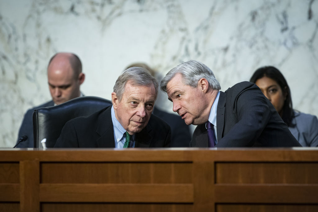 Senator Dick Durbin, a Democrat from Illinois and chairman of the Senate Judiciary Committee, left, speaks with Senator Sheldon Whitehouse, a Democrat from Rhode Island, during a confirmation hearing for Ketanji Brown Jackson, in Washington, D.C., on March 24, 2022. (Al Drago—Bloomberg via Getty Images)