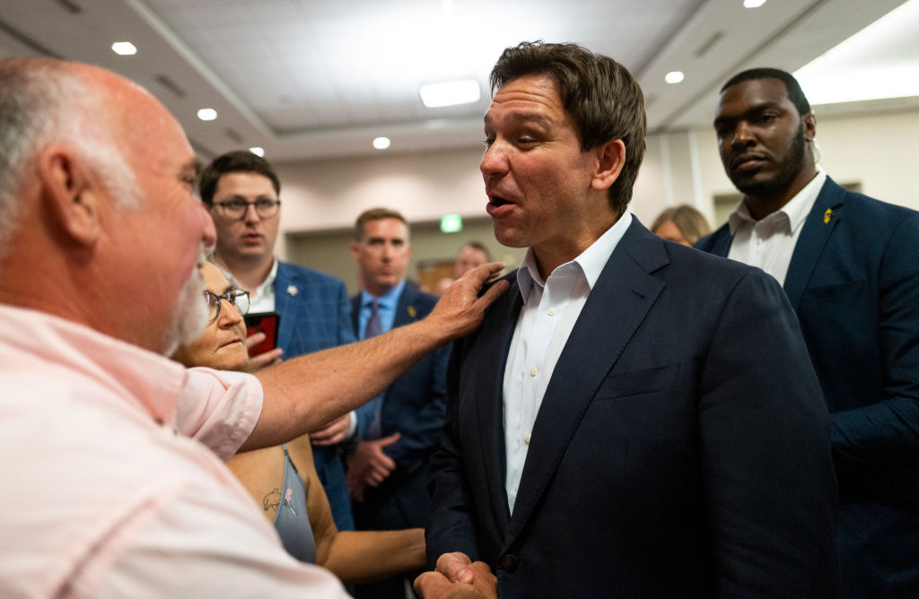 Florida Gov. Ron DeSantis speaks with attendees during an Iowa GOP reception on May 13, 2023 in Cedar Rapids (Stephen Maturen—Getty Images)