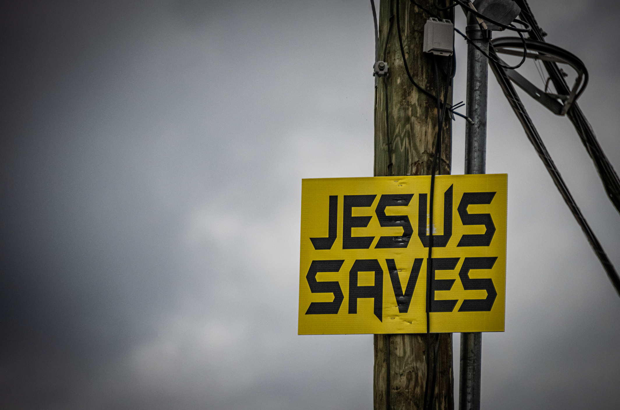 A "Jesus Saves" sign is tacked to a telephone pole. (Getty Images/Darwin Brandis)