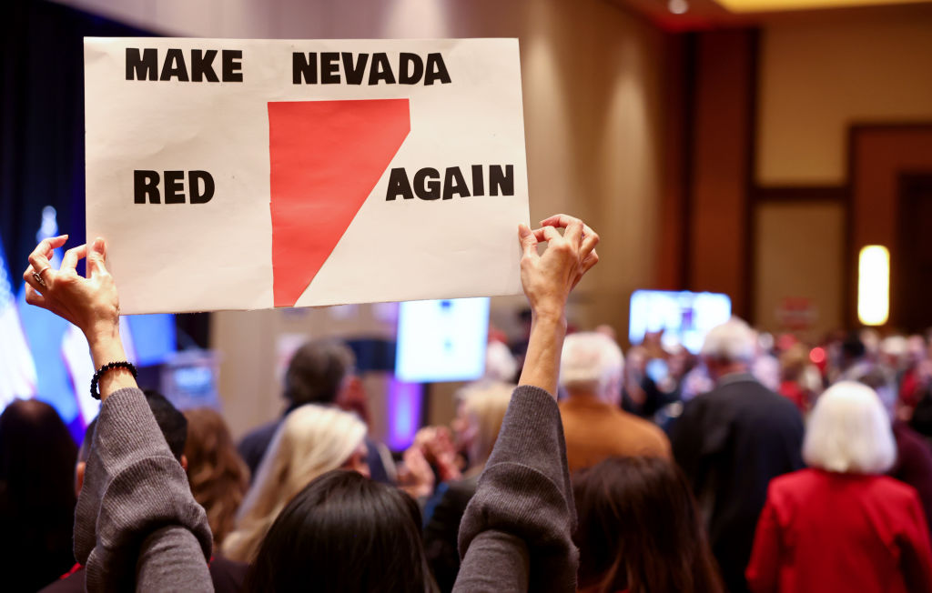 An attendee holds up a "Make Nevada Red Again" sign at a Republican midterm election night party at Red Rock Casino on November 08, 2022 in Las Vegas (Mario Tama—Getty Images)