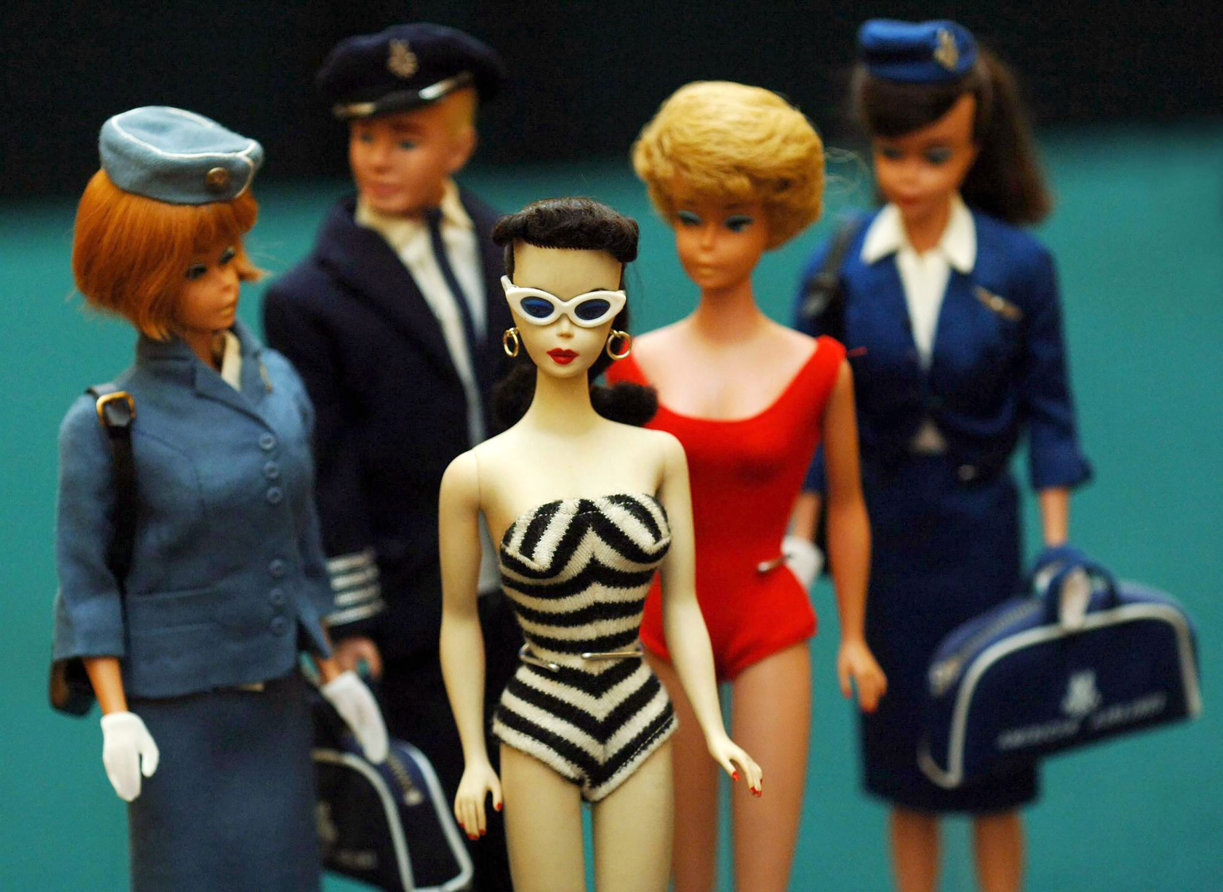 A group of vintage barbie dolls