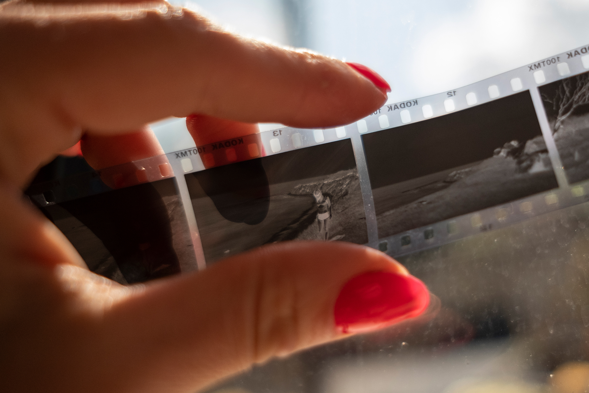Fox Weber holds a 35mm negative film strip from a disposable camera she brought with her on a trip to Montauk with Peter Beard. (Gabriella Demczuk for TIME)