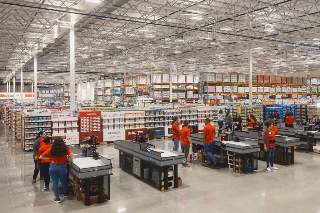 Workers at check-out counters during the grand opening of a Costco Wholesale store in Kyle, Texas on Thursday, March 30, 2023. The new wholesale store is around 160,000 square feet, and the gas station is outfitted with 24 pumps. (Jordan Vonderhaar—Bloomberg/ Getty Images)