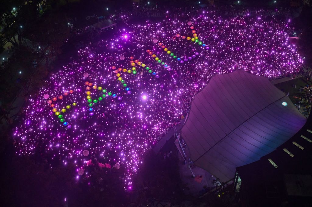Supporters form the word 'Family' during the annual Pink Dot event in a public show of support for the LGBTQ community at Hong Lim Park in Singapore on June 24, 2023.
