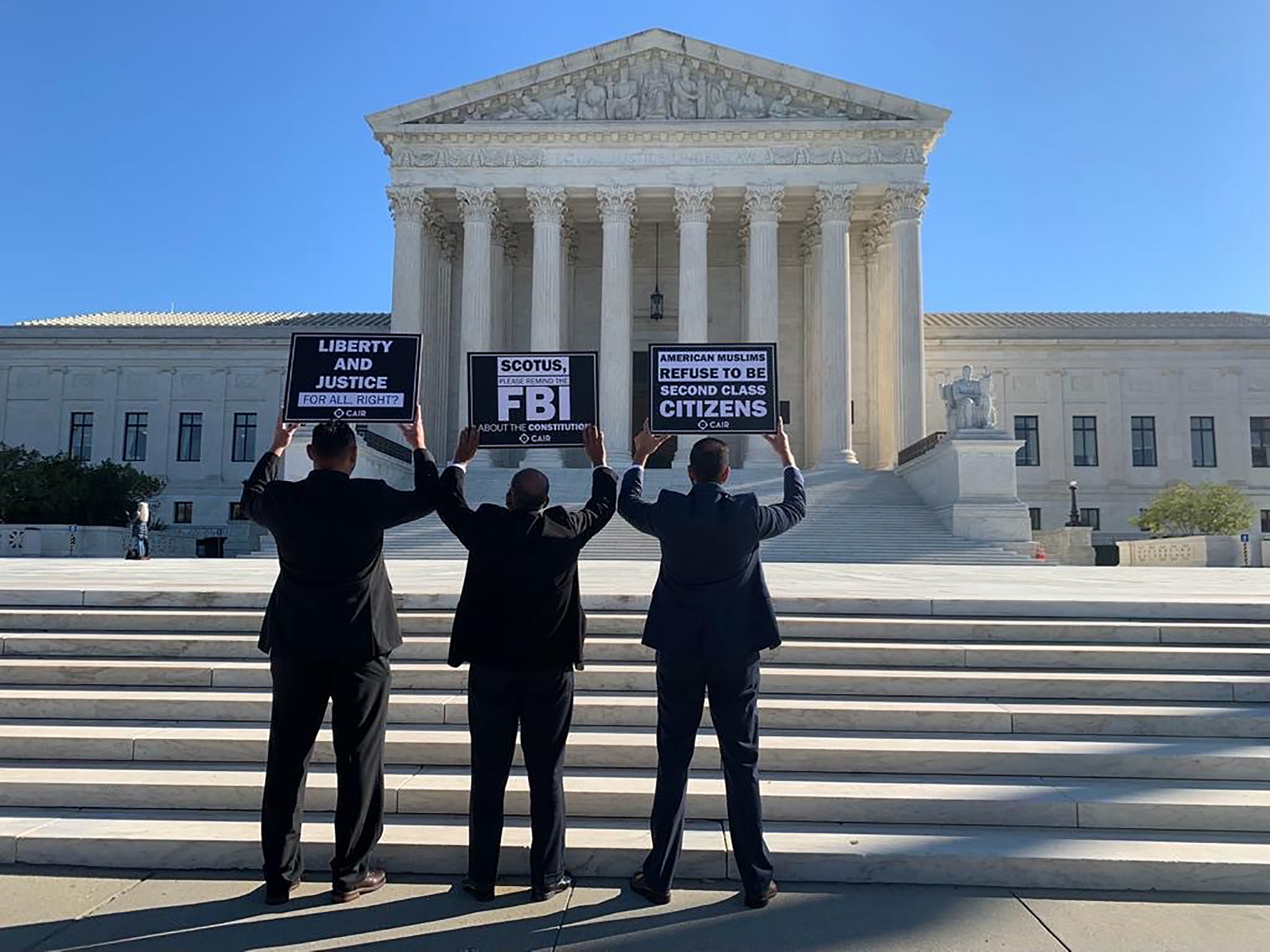 From left, Yasser AbdelRahim, Sheikh Yassir Fazaga and Ali Malik, the plaintiffs in FBI v Fazaga, in front of the Supreme Court in Washington, D.C., on Nov. 8, 2021. (Courtesy Gabriela Domenzain)