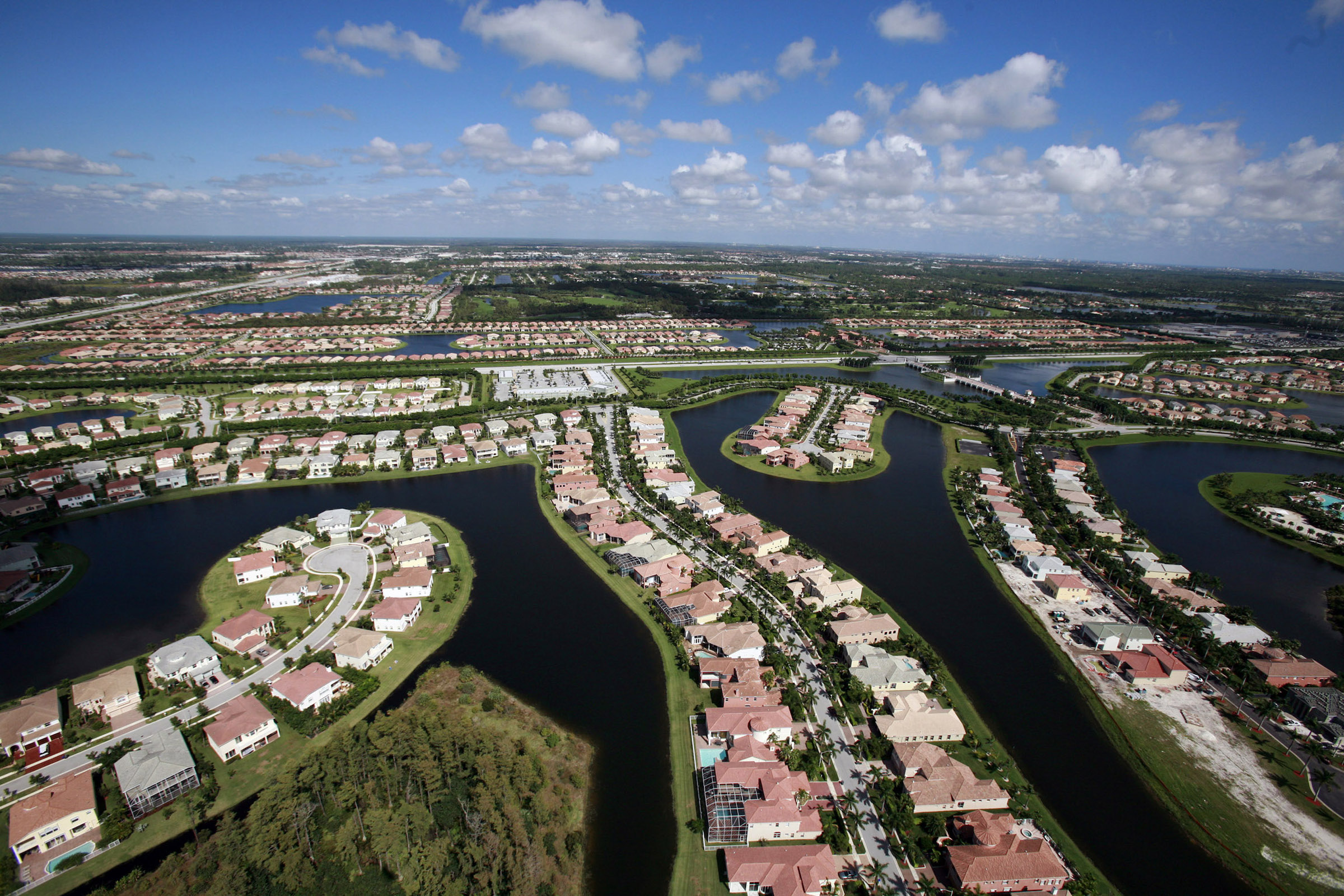 An aerial view of housing developments located near the northern part of the Everglades in Palm Beach county, Fla., Oct. 23, 2007. Thousands of acres of wetlands and wildlife habitat continue to disappear, paved by developers or blasted by rock miners to feed the hungry construction industry. (Barbara P. Fernandez—The New York Times/Redux)