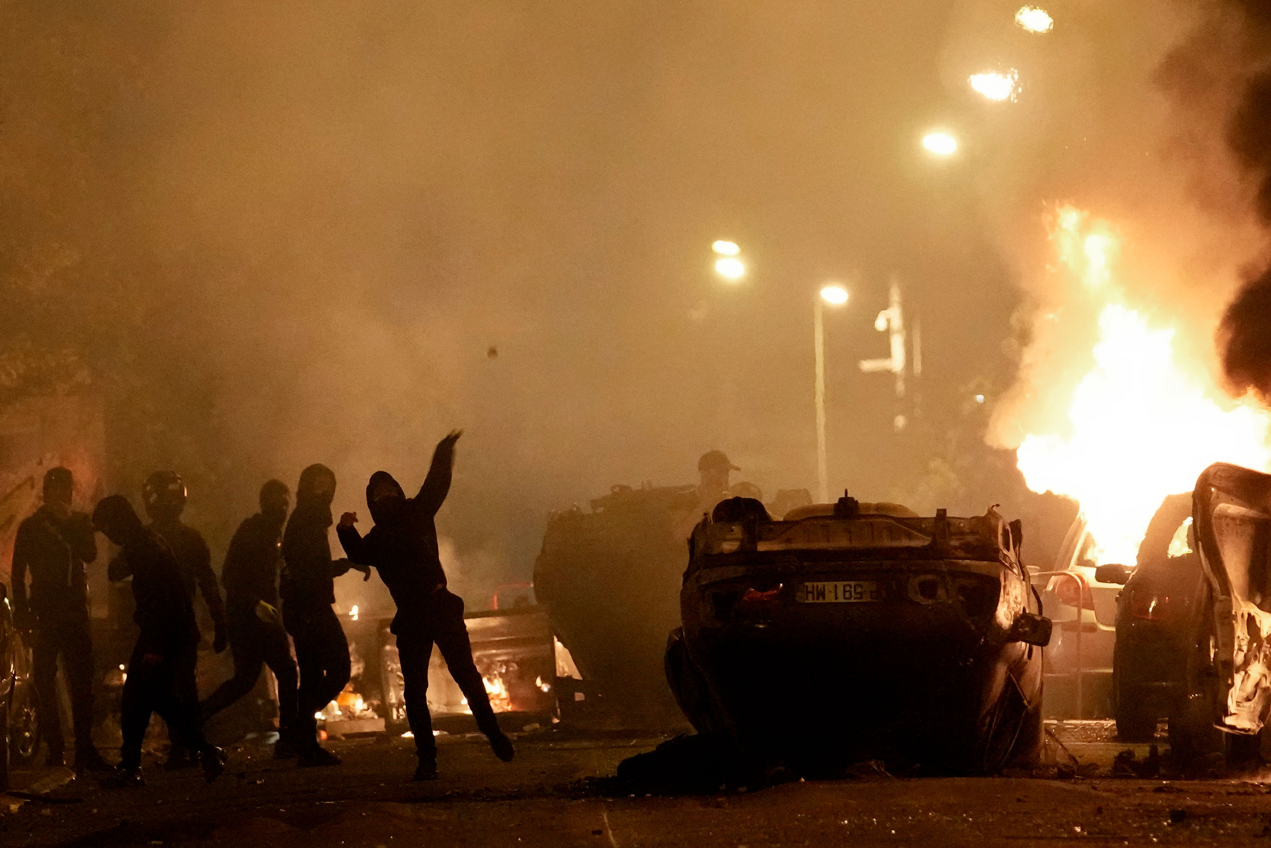 Youth clash with police forces in Nanterre, outside Paris, on June 29, 2023. (Christophe Ena—AP)