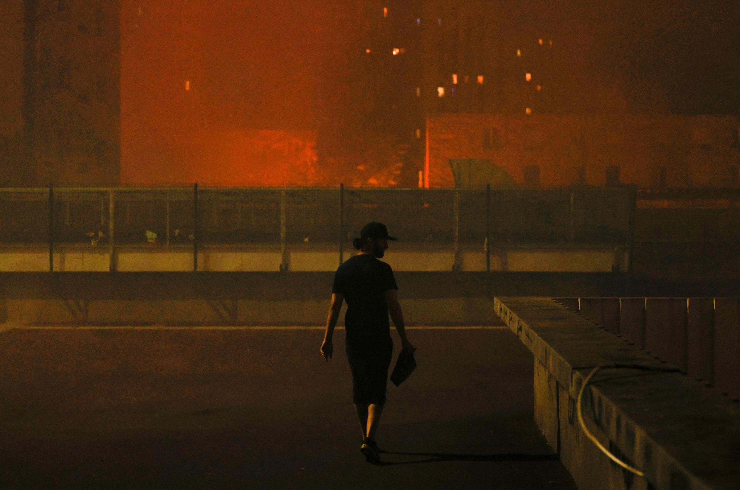 A resident looks on during protests in Nanterre in the early hours of June 29, 2023.