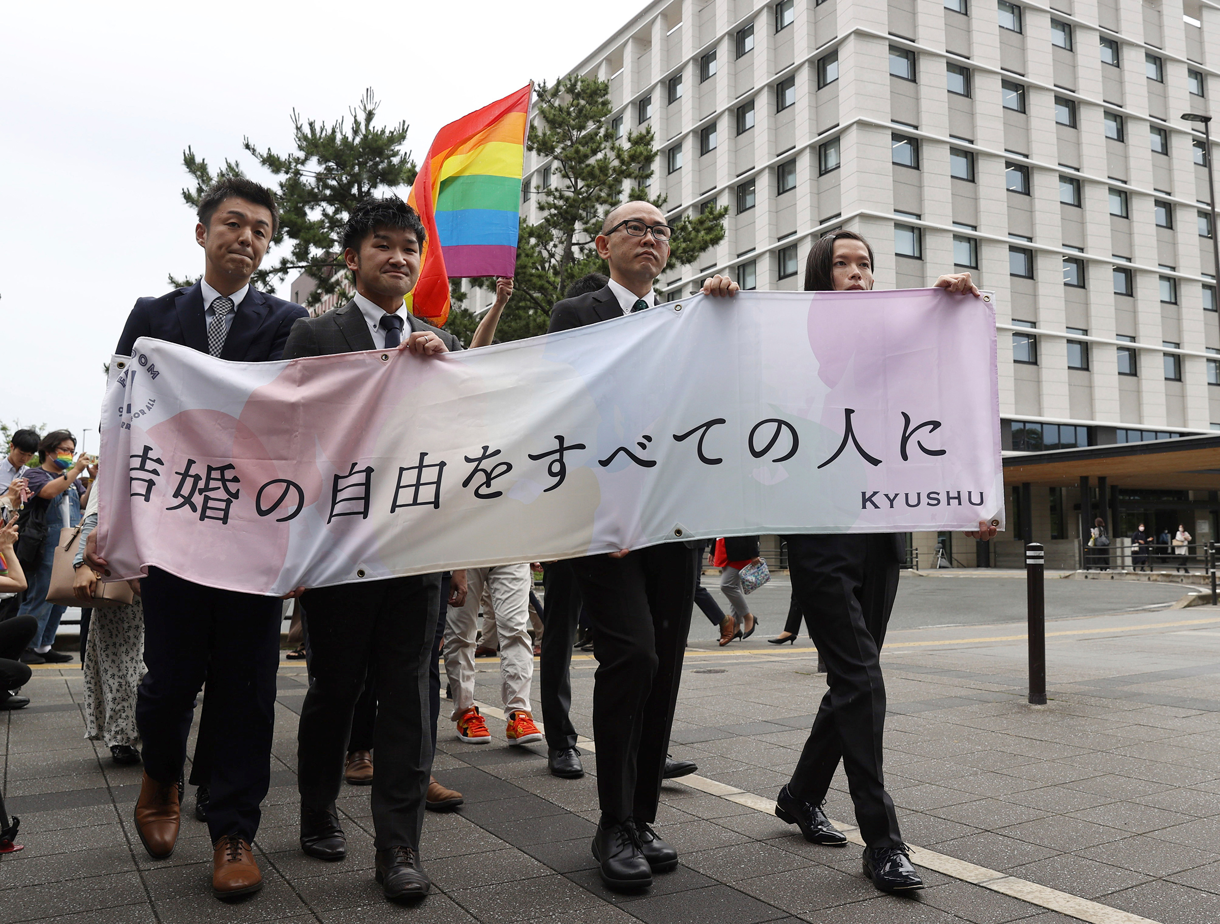 Plaintiffs head to the court for the same-gender marriage lawsuit at the Fukuoka District Court on June 8, holding a banner that reads "Marriage freedom for all." (The Yomiuri Shimbun/AP)