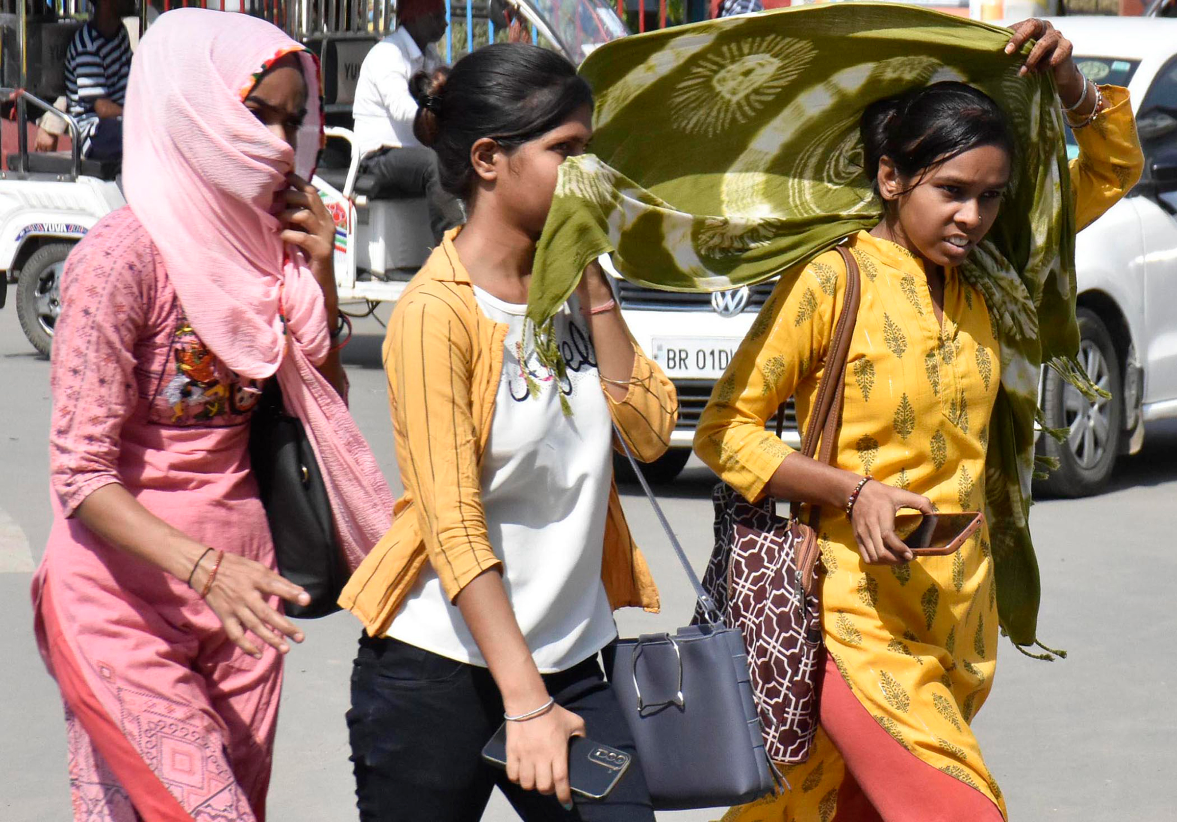 Women covering their face with dupatta during a hot summer day at Kargil Chowk, in Patna, India, on June 4. (Santosh Kumar—Hindustan Times/Getty Images)