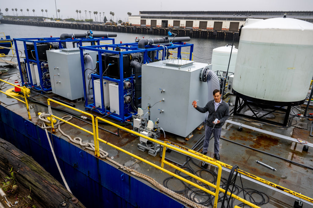 Dante Simonetti, chemical and biomolecular associate professor, UCLA Samueli Associate Director, ICM, stands on the first of its kind scientific barge to demonstrate an electrochemical process for removing carbon dioxide from the ocean on April 12, 2023 in San Pedro, Calif. (Gina Ferazzi / Los Angeles Times—Getty Images)