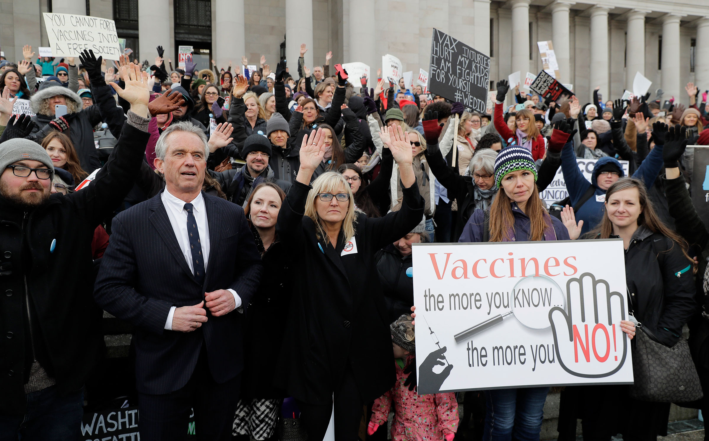 Kennedy with protesters at the Capitol in Olympia, Wash., in 2019, where they opposed a bill to tighten measles, mumps and rubella vaccine requirements for school-aged children. (Ted S. Warren—AP)