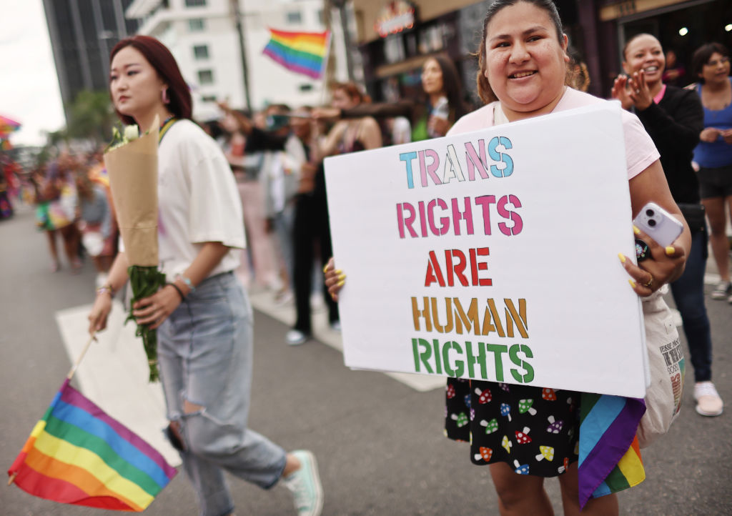 A participant holds a “Trans Rights Are Human Rights” sign during the 2023 LA Pride Parade in Hollywood on June 11, 2023 in Los Angeles, California. (Mario Tama—Getty Images)