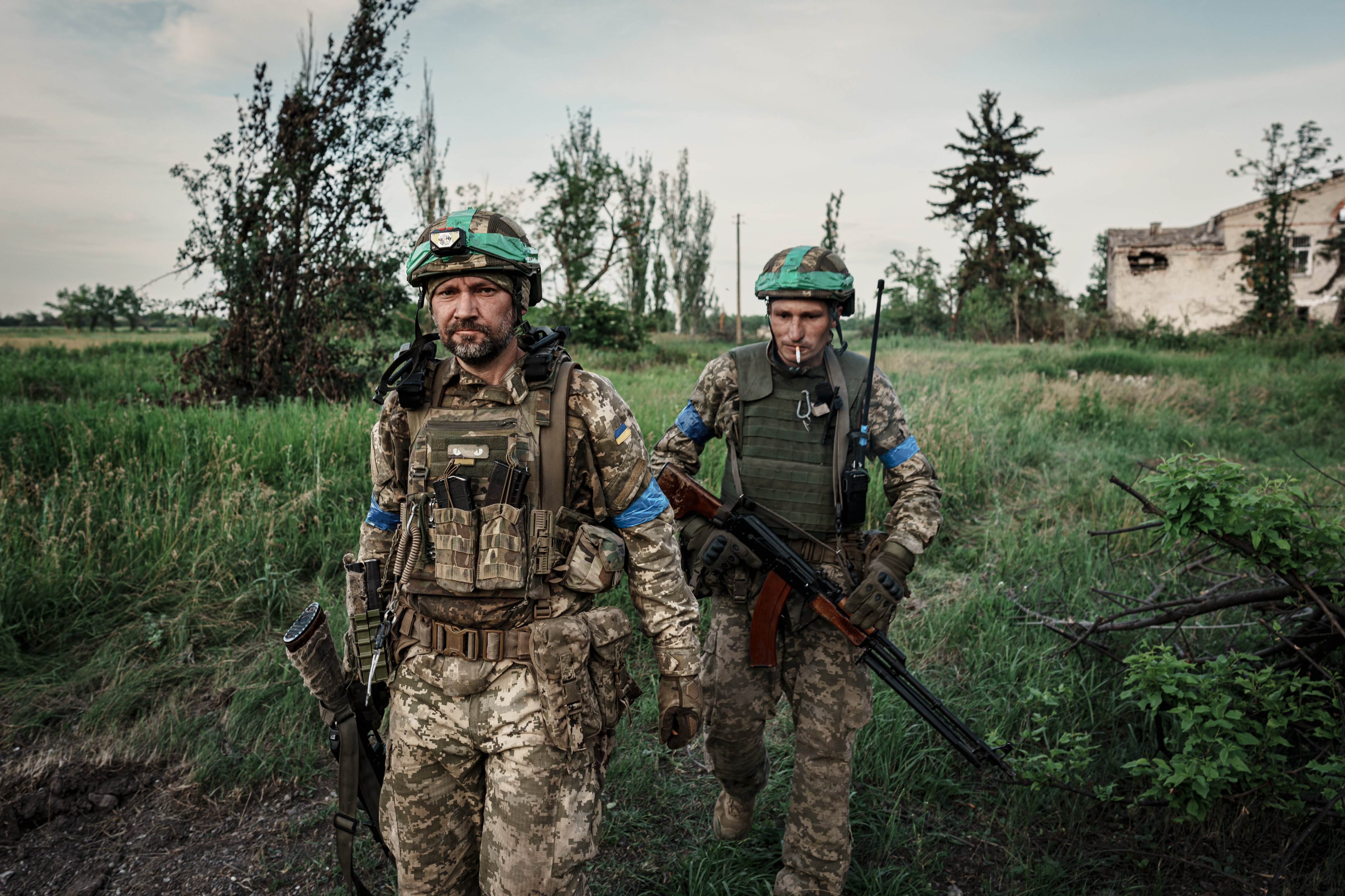 Soldiers of the 68th Jaeger Brigade "Oleksa Dovbush" walk in the newly liberated village on June 10, 2023 in Blahodatne, Ukraine. The village Blahodatne located on the border between Donetsk and Zaporizhzhia Oblasts. (Serhii Mykhalchuk–Global Images Ukraine/Getty Images)