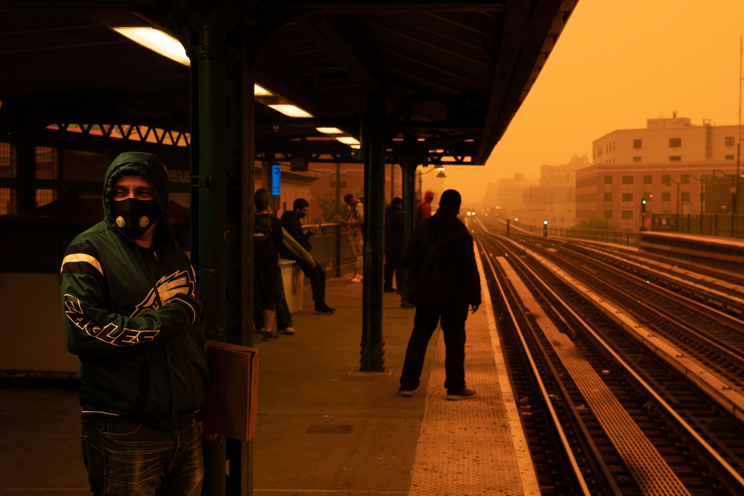 A person waiting for the subway wears a filtered mask as smoky haze from wildfires in Canada blankets a neighborhood in the Bronx, in New York City, on June 7, 2023. (David Dee Delgado—Getty Images)