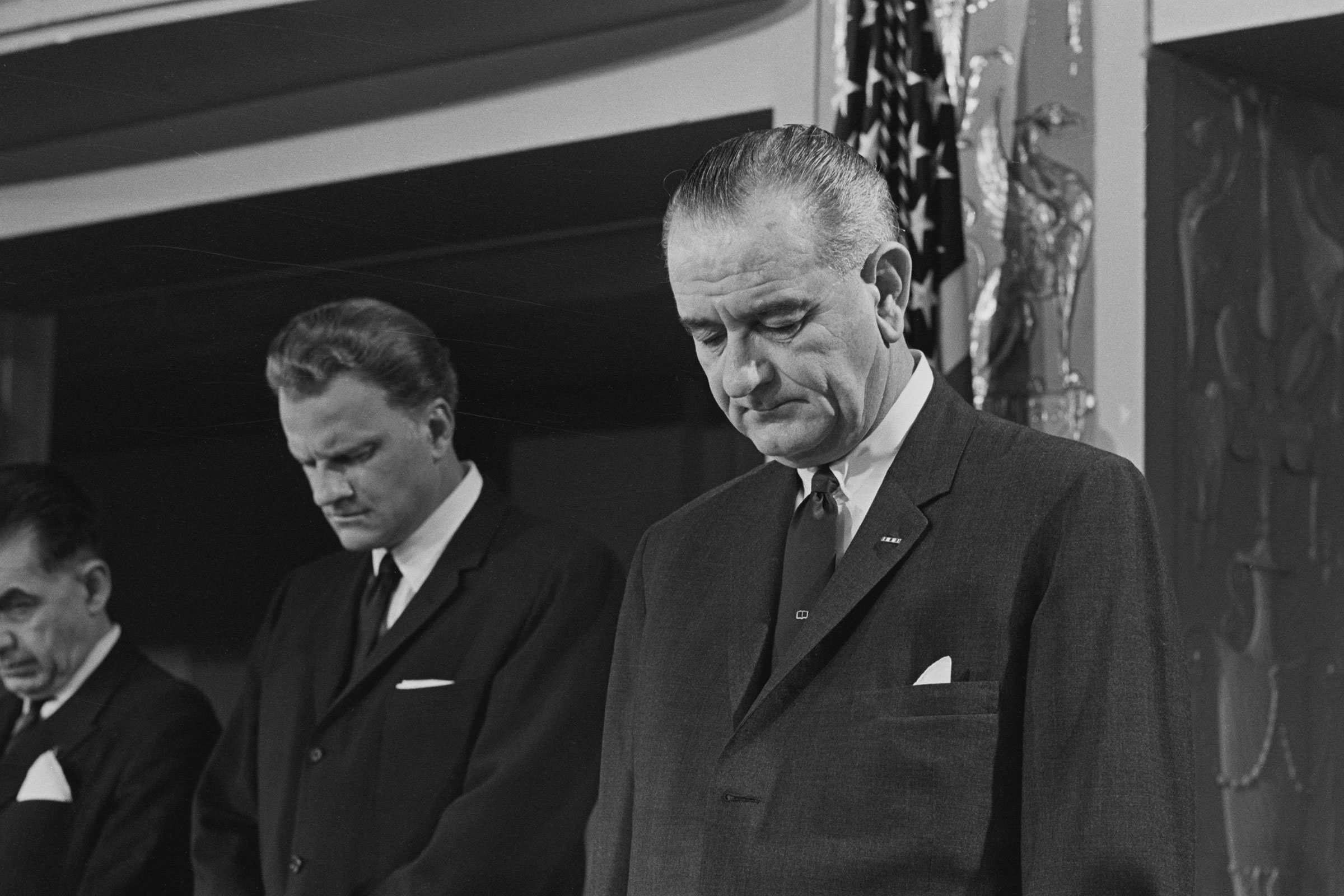 Billy Graham And Lyndon Johnson bow their heads in Prayer