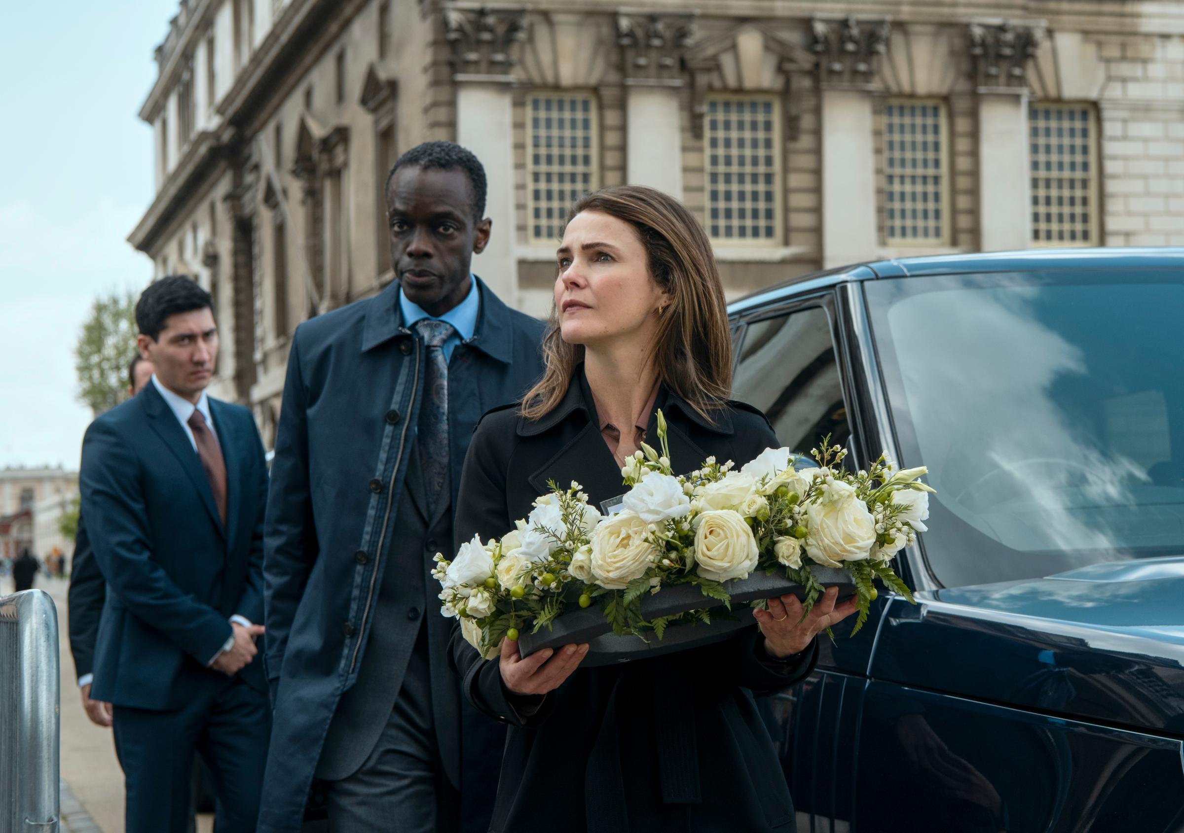 The Diplomat. (L to R) Kenichiro Thomson as Martin, Ato Essandoh as Stuart Heyford, Keri Russell as Kate Wyler in episode 101 of The Diplomat. Cr. Alex Bailey/Netflix © 2023