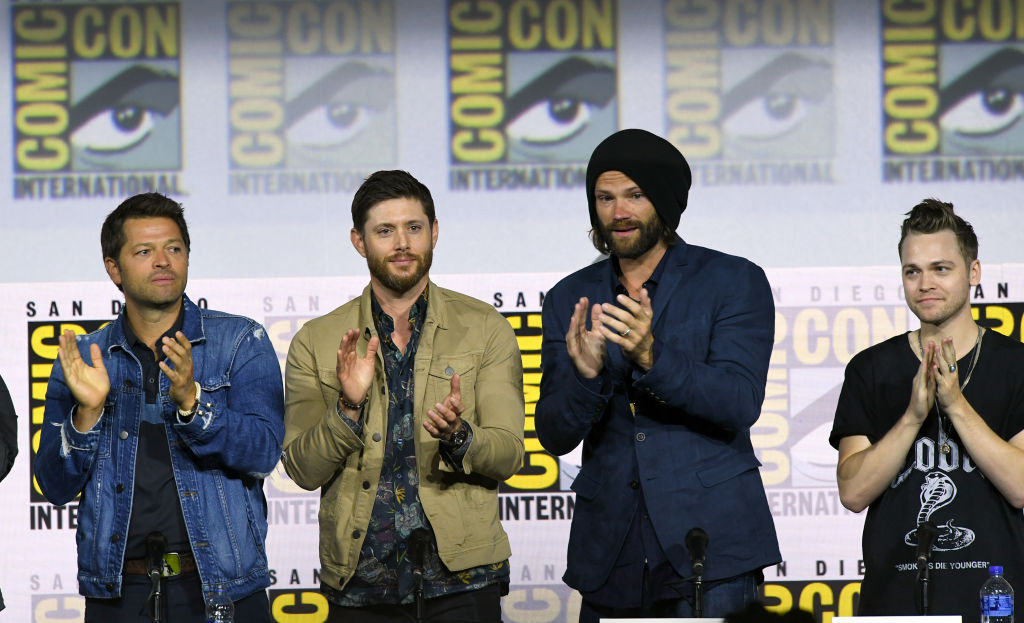 Misha Collins, Jensen Ackles, Jared Padalecki, and Alexander Calvert at a <em>Supernatural</em> convention in 2019. (Albert L. Ortega—Getty ImagesCastmembers)