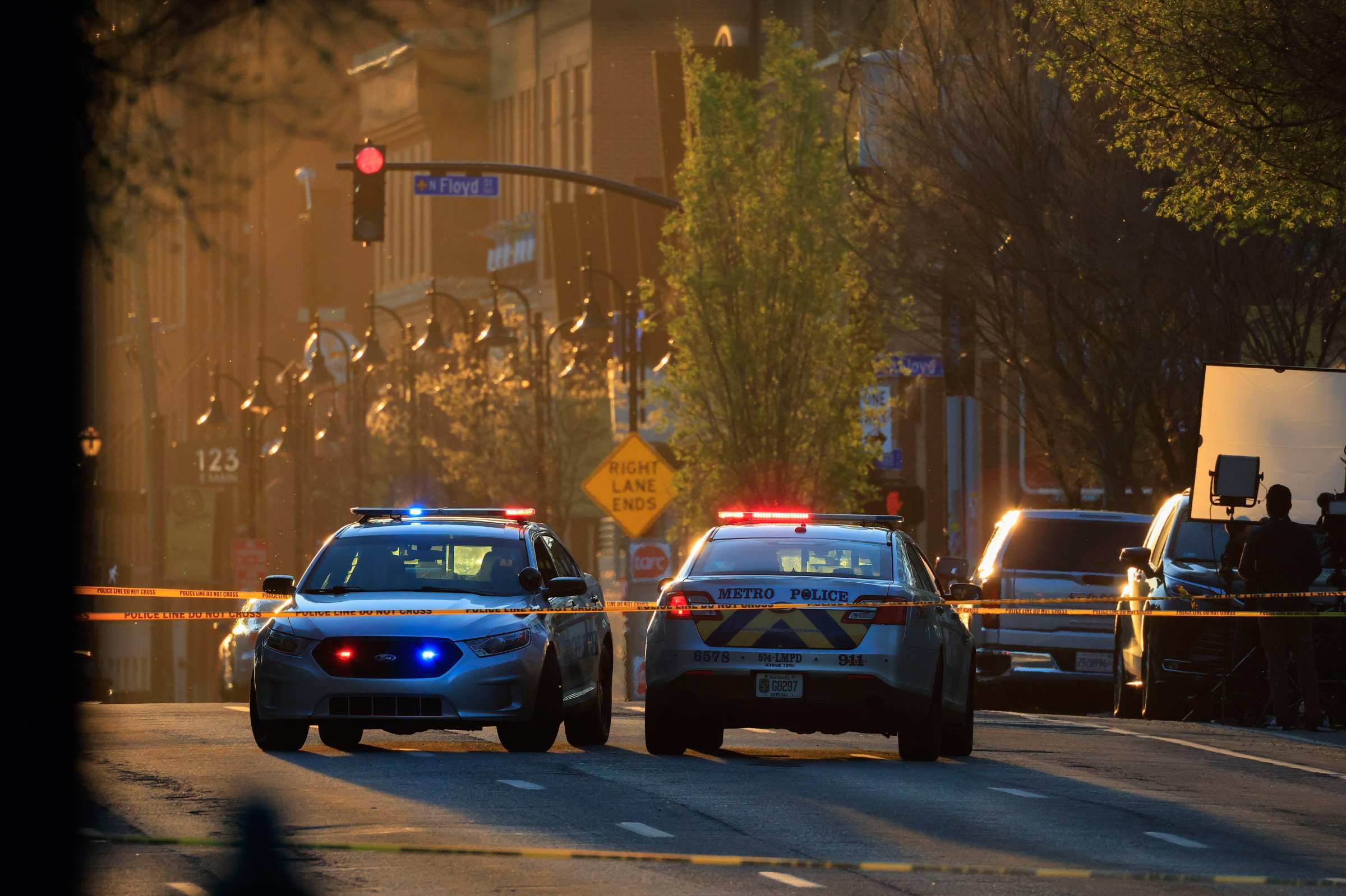 Police cars block Main Street in Louisville, KY, following a shooting in April 2023.