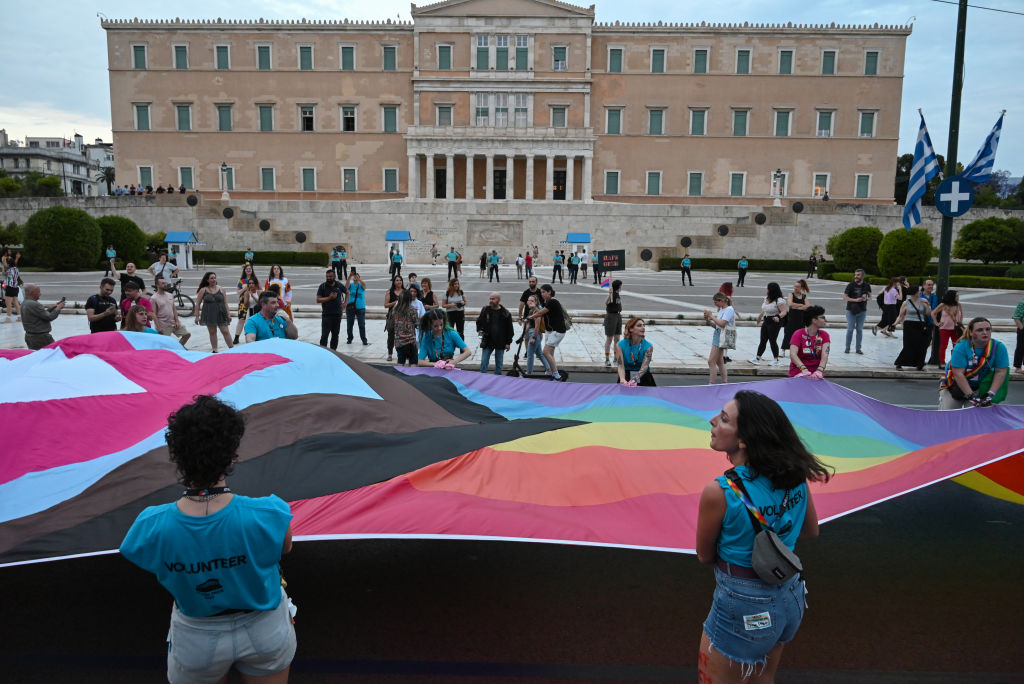 Participants wave a giant rainbow flag in front of the Greek Parliament during the Pride Parade in Athens, Greece on June 10, 2023. (Nicolas Koutsokostas—NurPhoto/Getty Images)