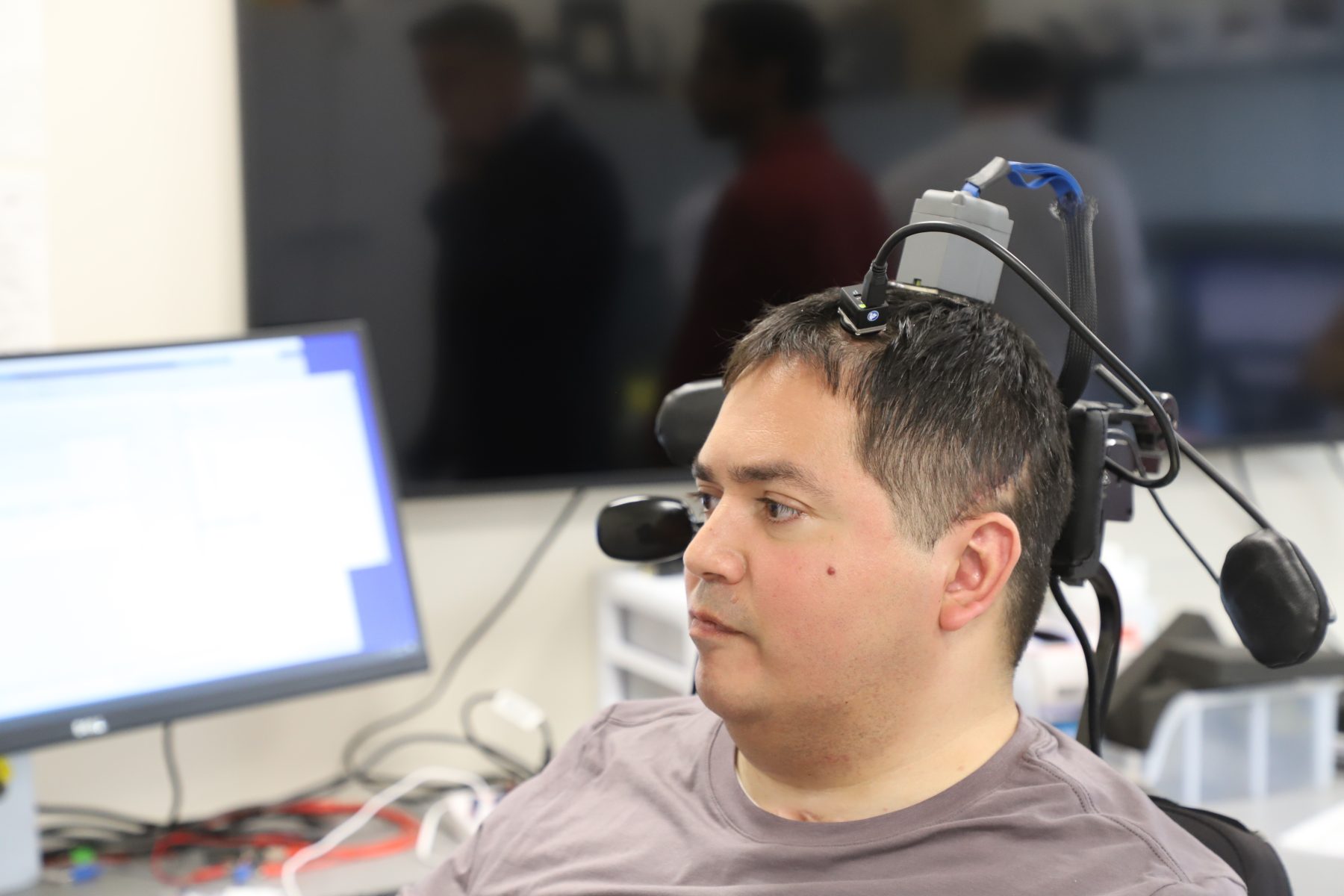 Keith Thomas, paralyzed from the chest down, can now move and feel again, with the help of AI.