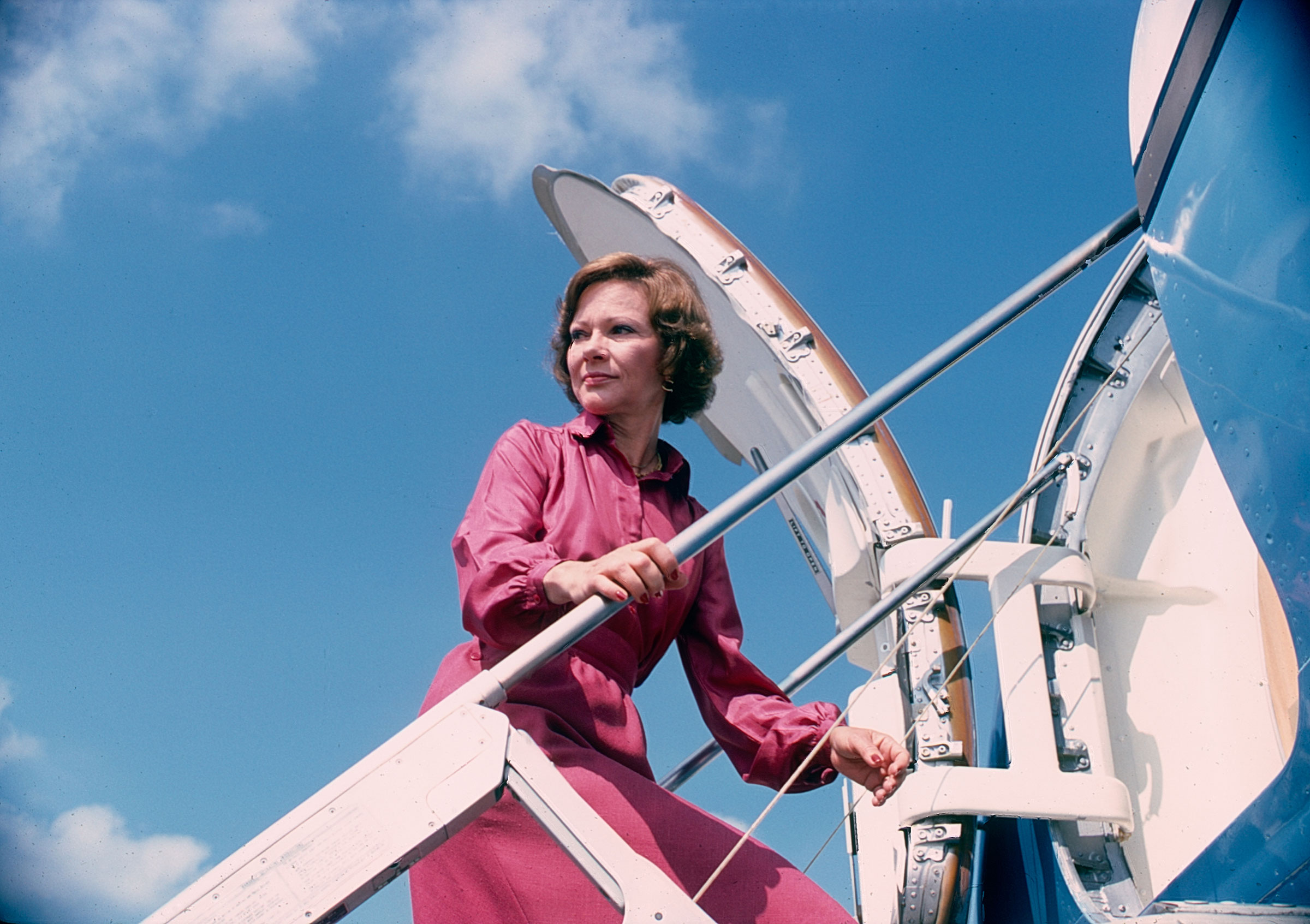 First Lady Rosalynn Carter climbs the steps to her plane during a trip, Texas, Sept. 1978. (Diana Walker—Getty Images)