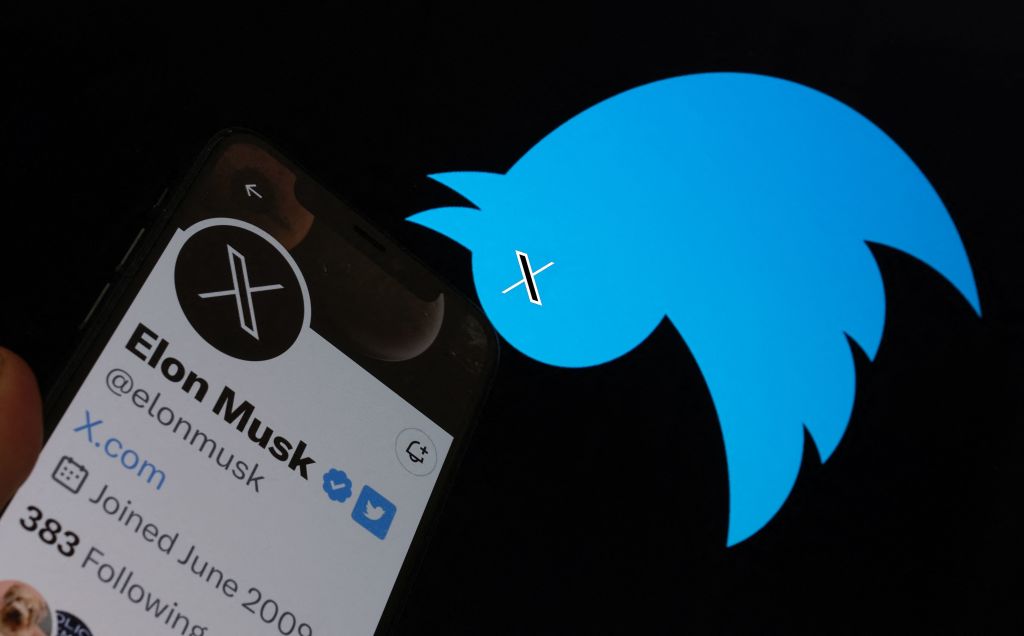 This illustration photo taken on July 24, 2023 shows the Twitter bird logo upside down in the background of Elon Musk's screen advertising an "X" as a replacement logo, in Los Angeles. Elon Musk killed off the Twitter logo on July 24, 2023, replacing the world-recognized blue bird with a white X as the tycoon accelerates his efforts to transform the floundering social media giant. Musk and the company's new chief executive Linda Yaccarino announced the rebranding on July 23, 2023, scrapping one of technology's most iconic brands in the latest shock move since the tycoon took over Twitter nine months ago.