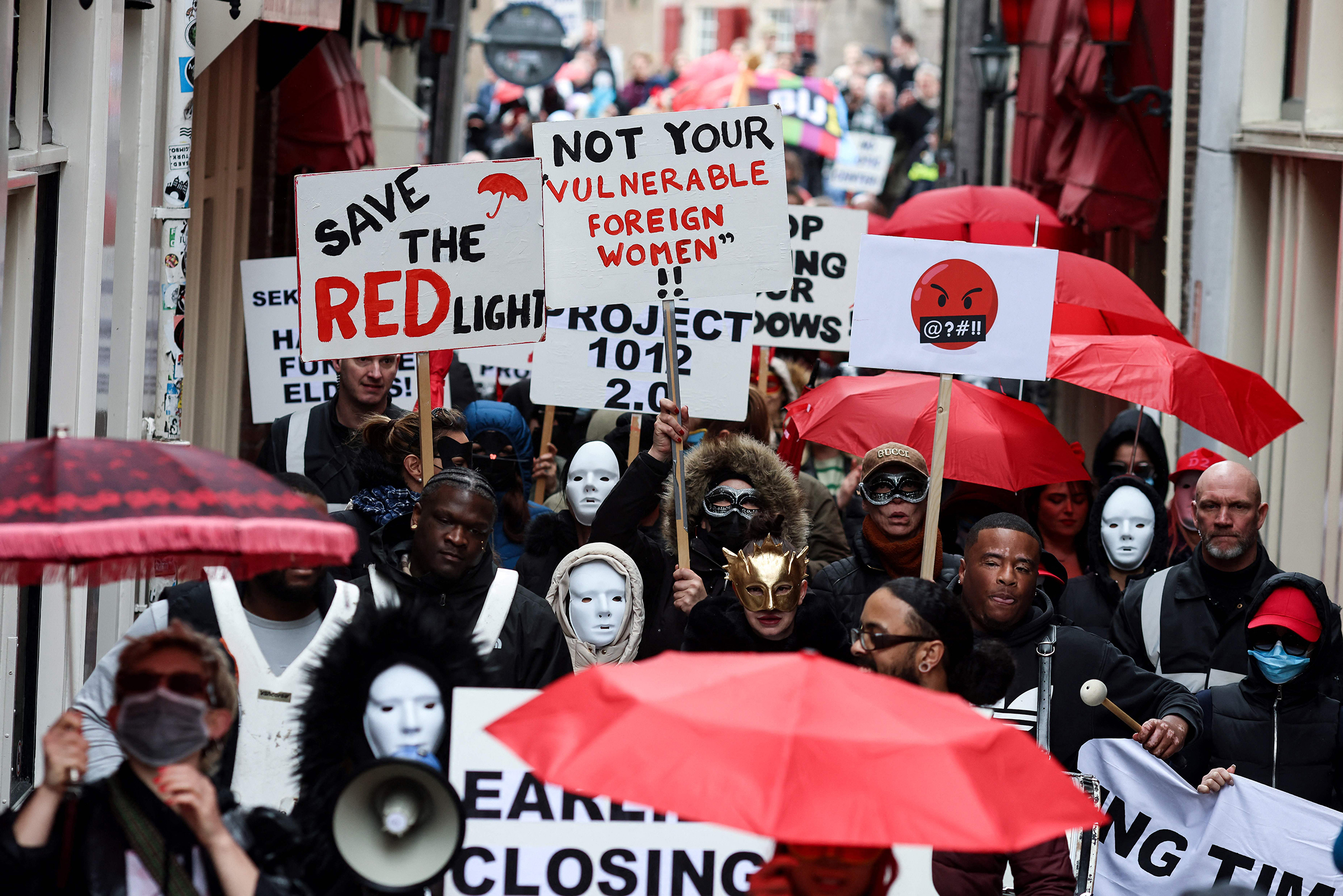 Sex workers and sympathizers take part in a demonstration to protest plans to shutter the city's historic red light district, to be moved to a new erotic centre, in Amsterdam on March 30. (Kenzo Tribouillard—AFP/Getty Images)
