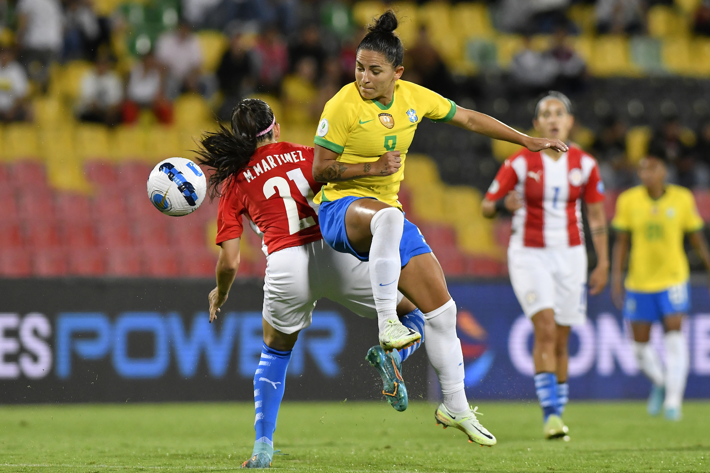 Maria Martinez of Paraguay competes for the ball with Debinha of Brazil during the Women's CONMEBOL Copa America 2022 Semi Final match between Brazil and Paraguay at Estadio Alfonso Lopez on July 26, 2022 in Bucaramanga, Colombia. (Gabriel Aponte—Getty Images)