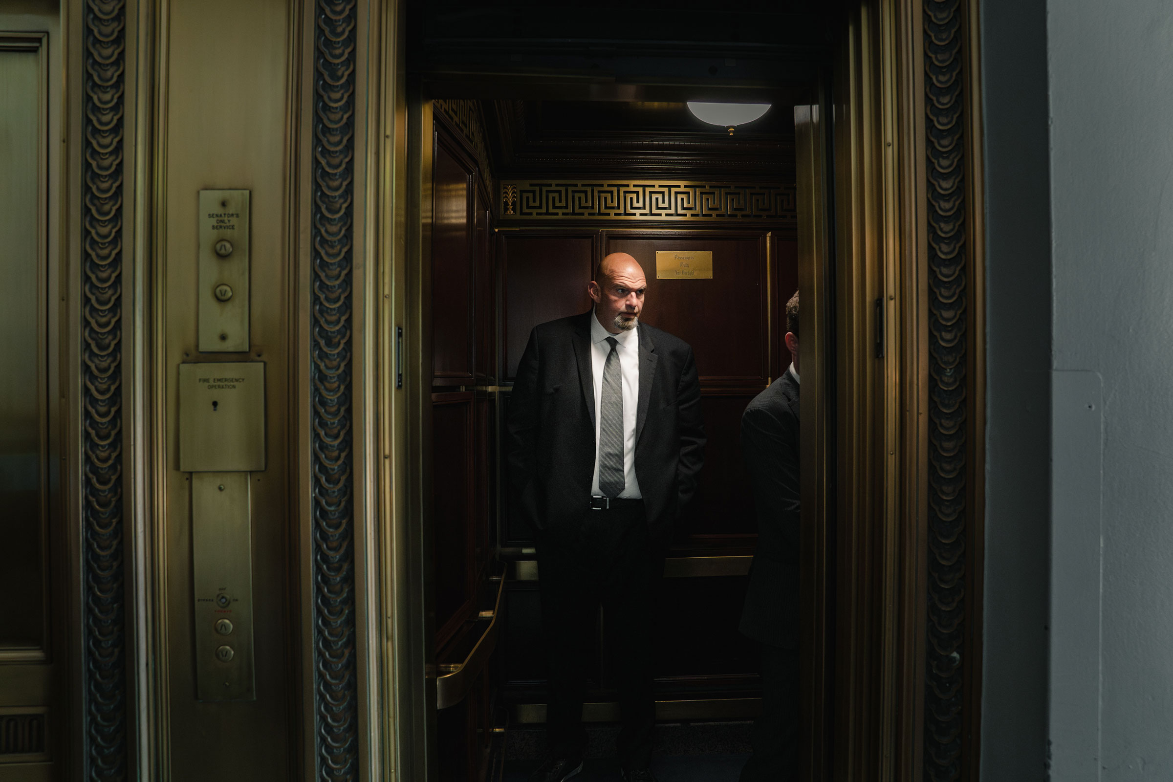 Fetterman takes the elevator before heading to a Senate vote on Capitol Hill (Shuran Huang for TIME)