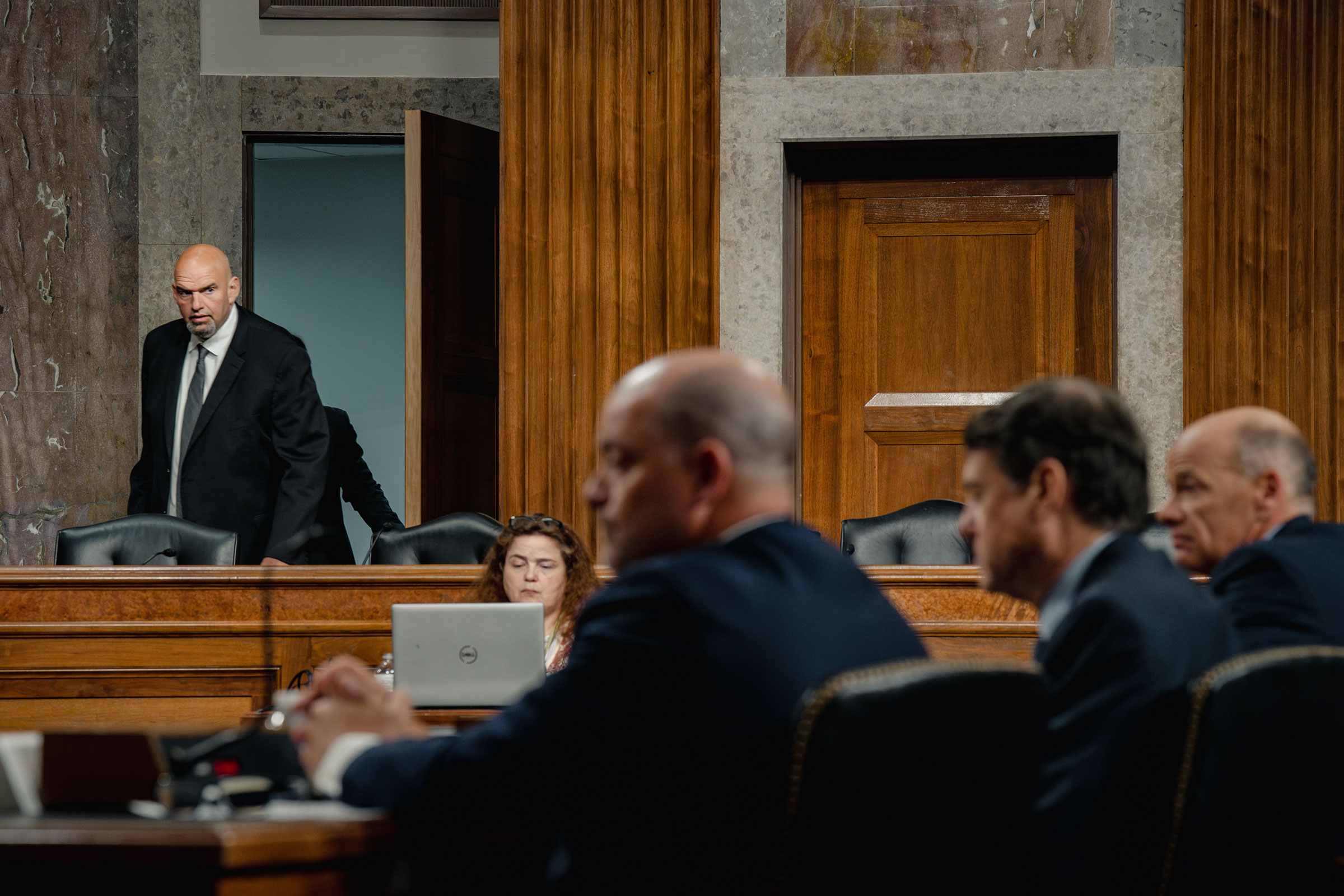 Fetterman walks into a Senate Banking, Housing, and Urban Affairs Committee hearing (Shuran Huang for TIME)