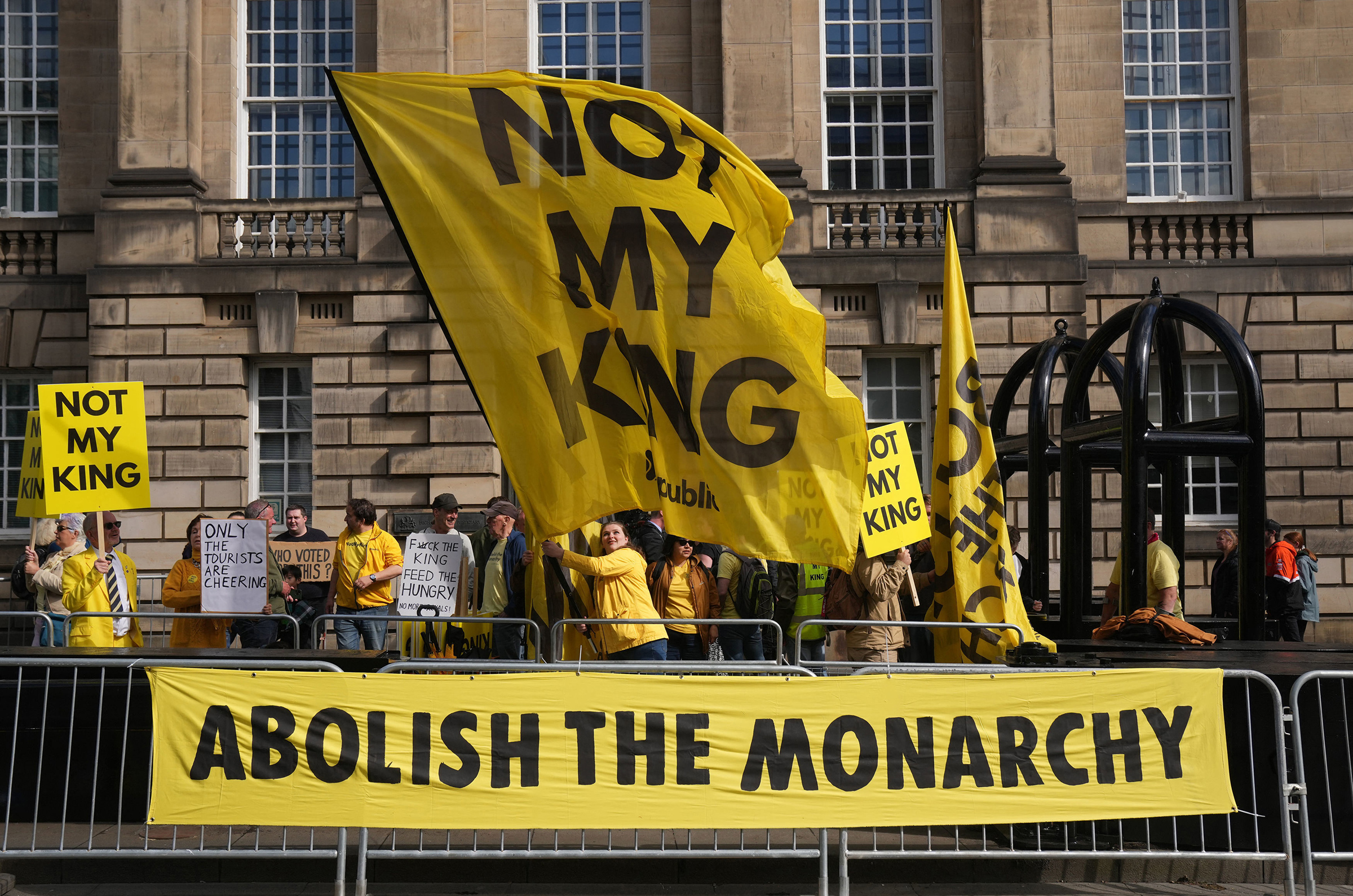 Anti-monarchy protesters gather near St Giles' Cathedral ahead of a National Service of Thanksgiving and Dedication, in Edinburgh on July 5.