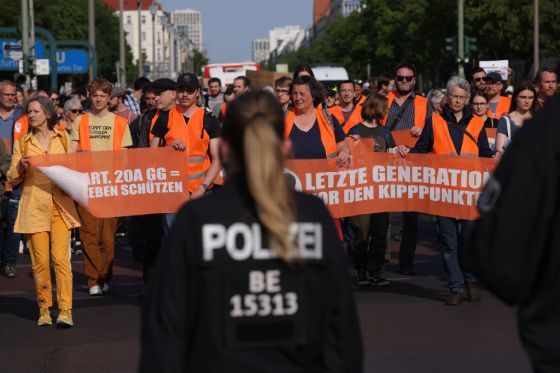 Supporters of the climate action group Last Generation (Letzte Generation) march in protest following recent police raids against the group on May 26, 2023 in Berlin, Germany.