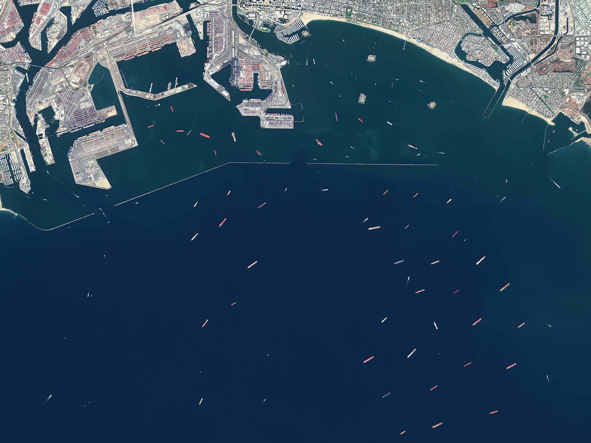 A satellite view of cargo ships waiting to offload at the Ports of Los Angeles on Oct. 10, 2021, during the Covid-19 pandemic. (Gallo Images/Orbital Horizon/Copernicus Sentinel Data/Getty Images)