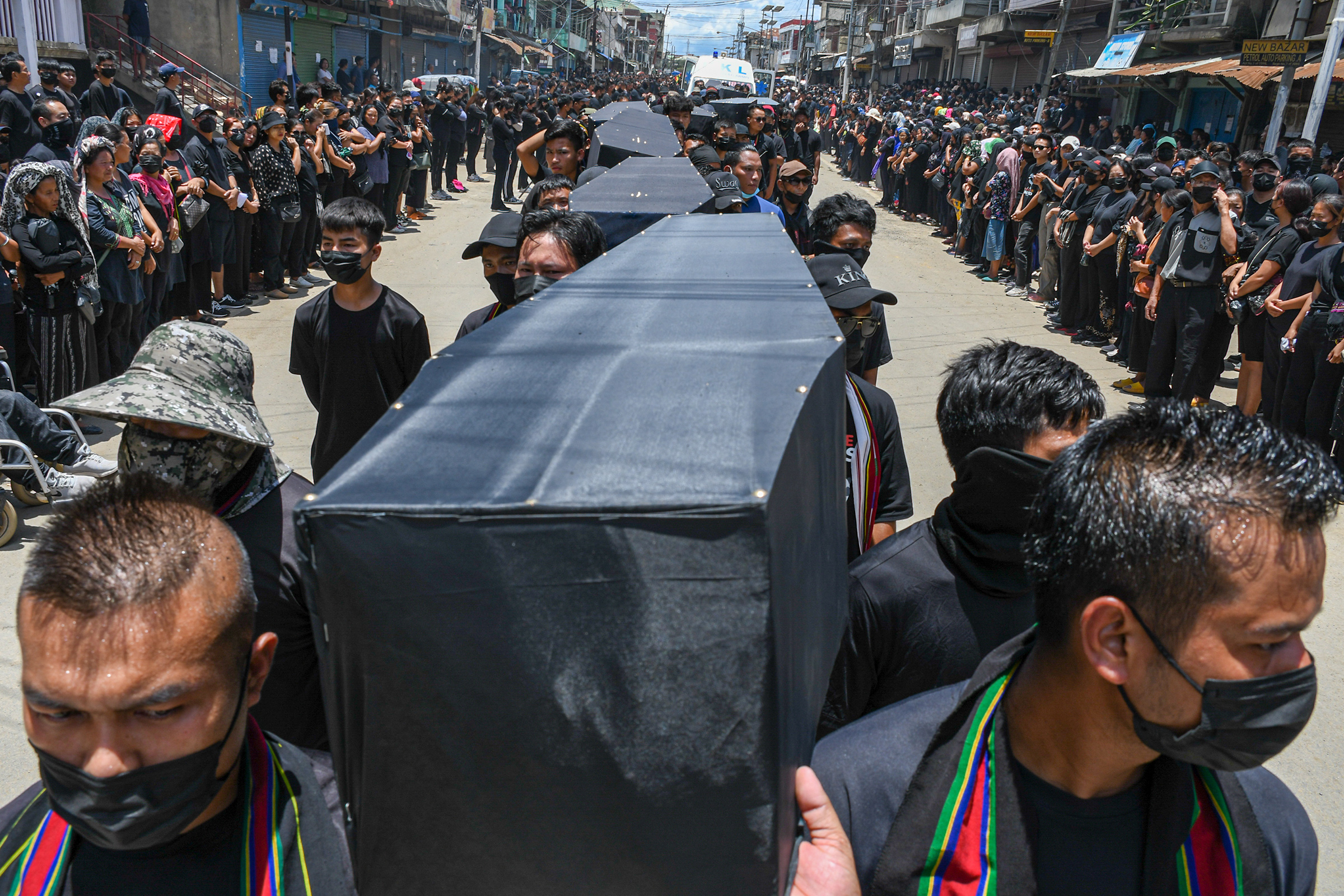 Residents of Churachandpur take part in a silent march while carrying dummy coffins to commemorate all the tribal people who lost their lives in the ethnic clashes in Manipur on June 23. (Biplov Bhuyan—SOPA Images/LightRocket/Getty Images)