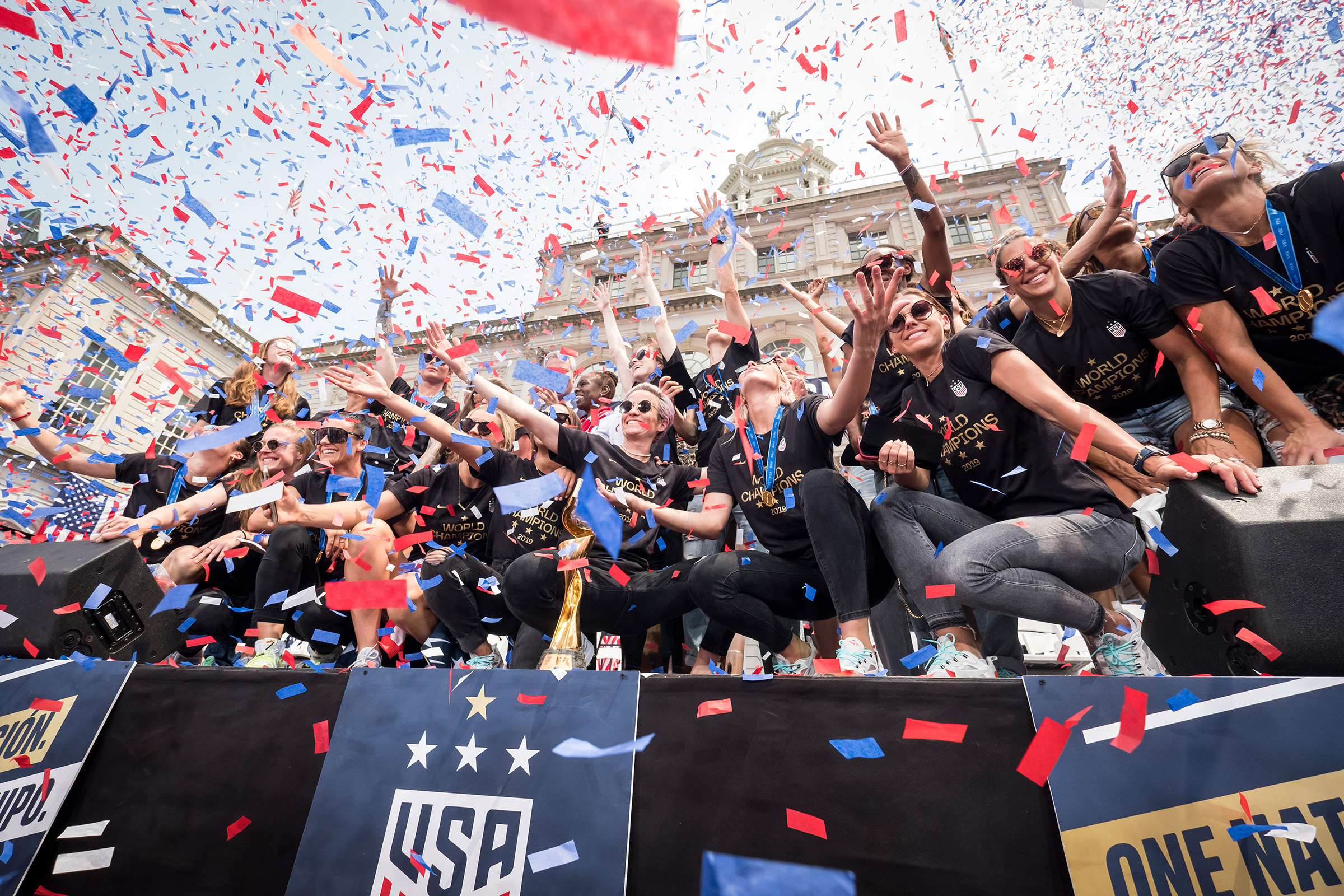 Rapinoe, center, celebrates the 2019 World Cup at a New York City parade (Ira L. Black—Corbis/Getty Images)