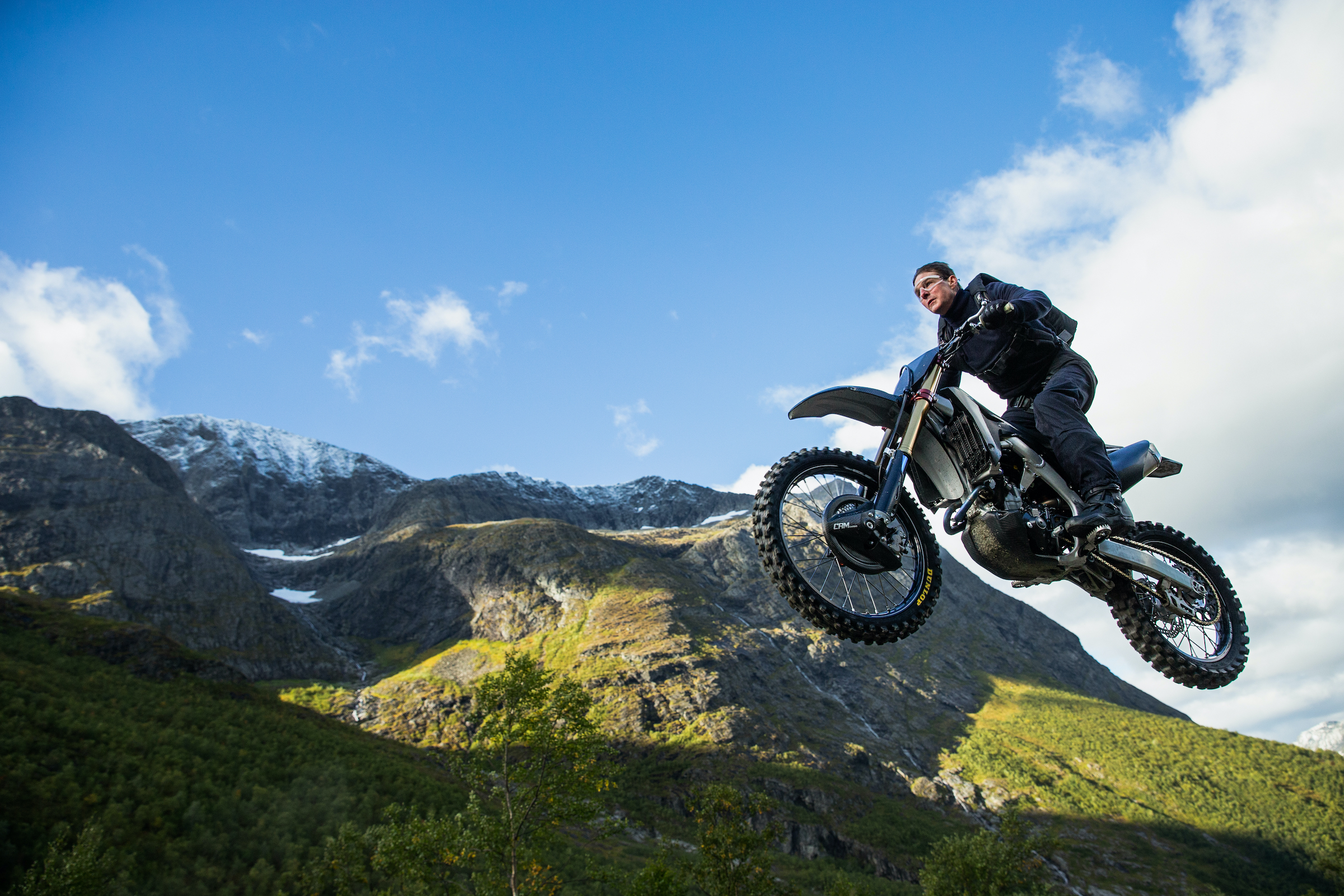 Cruise as Ethan Hunt, flying through the air on a motorcycle (Courtesy of Paramount Pictures)