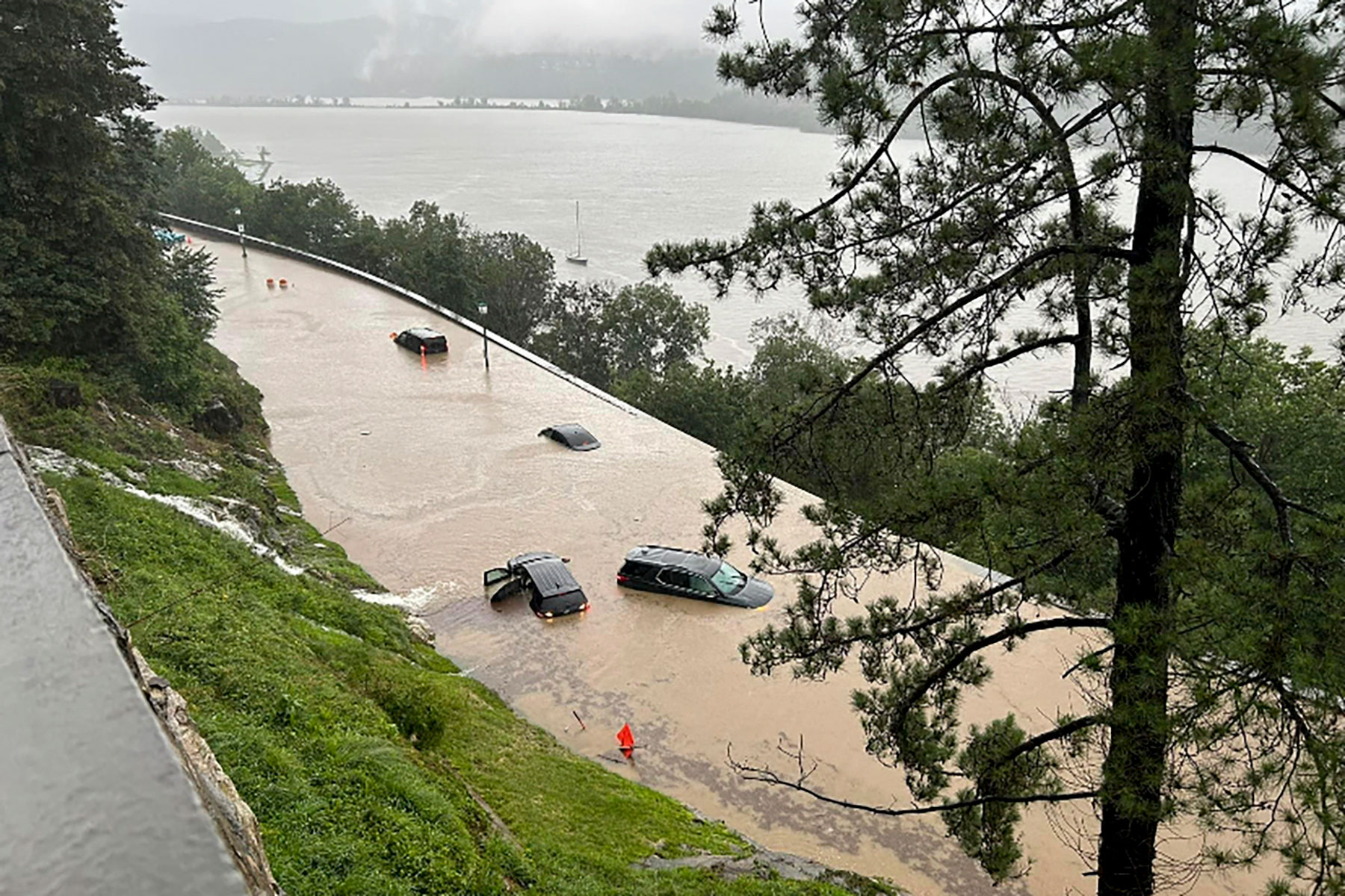 Cars sit stranded in standing flood water along Thayer Road on the campus of the United States Military Academy at West Point, in New York, on July 10, 2023. (USMA/AP)